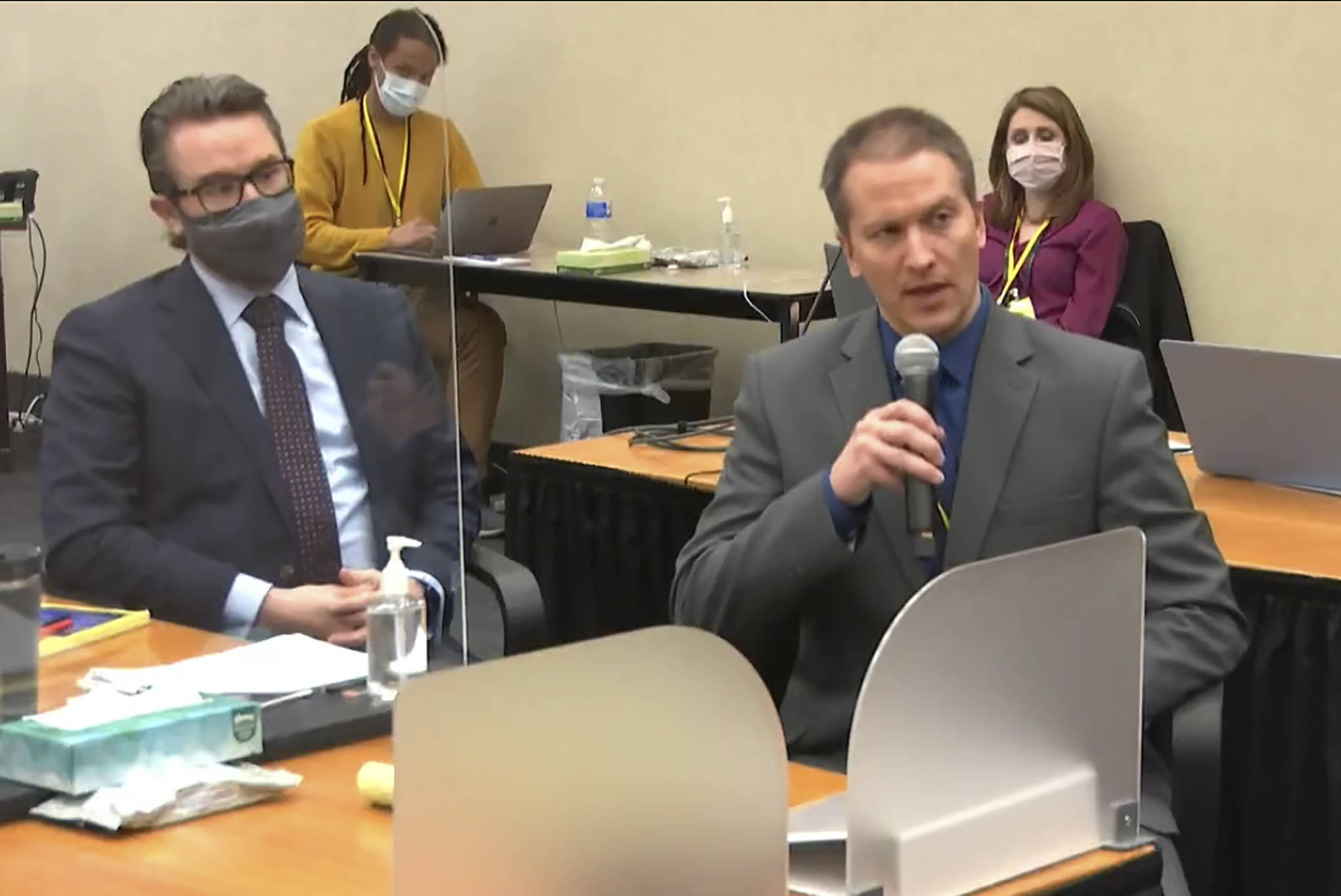 In this image from video, defense attorney Eric Nelson, left, and former Minneapolis police Officer Derek Chauvin address Judge Peter Cahill at the courthouse in Minneapolis during Chauvin’s trial in the death of George Floyd. (Court TV / Pool)
