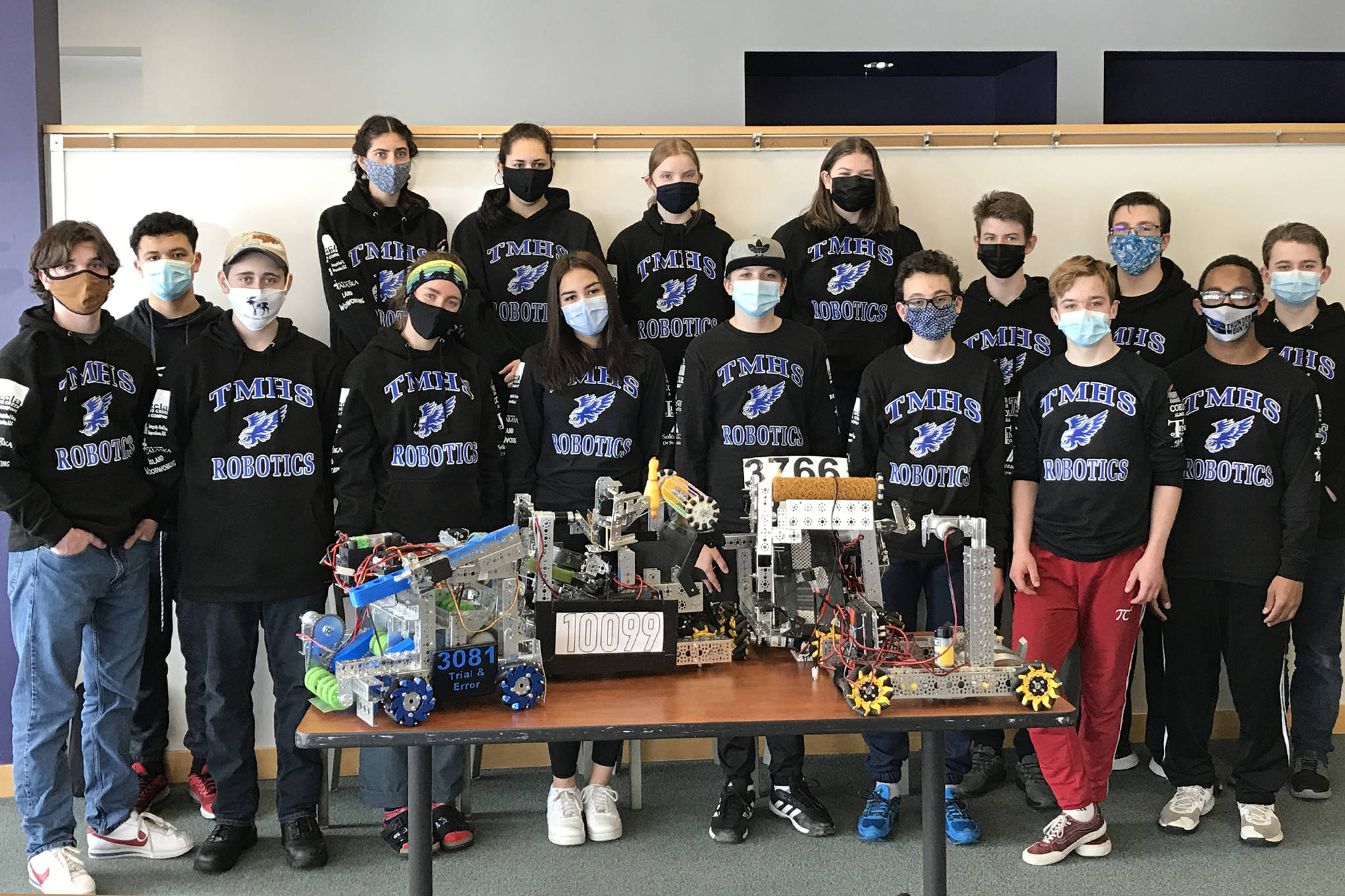 Members of Thunder Mountain High Schools four robotics teams stand with four robots. (Courtesy Photo / Carol May)