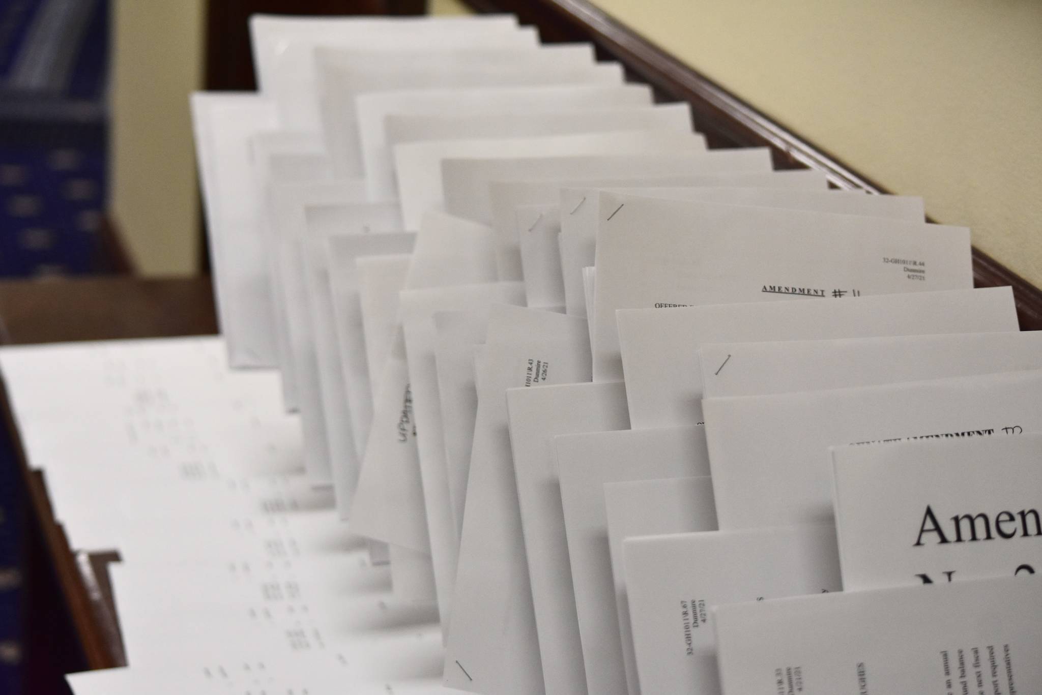 Dozens of amendments to a bill extending the state's disaster declaration are laid out on a table outside the Senate chambers on Wednesday, April 28, 2021. Lawmakers eventually passed the bill, but didn't adjourned until late in the evening. (Peter Segall / Juneau Empire.)
