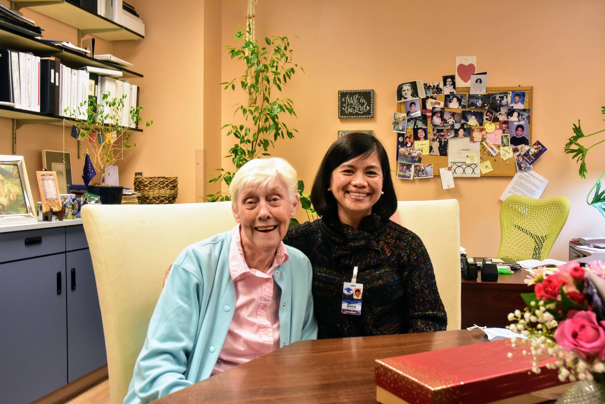 Juneau Pioneer Home resident Phyllis Woodman, left, sits with the home's administrator Gina Del Rosario, right, on Thursday, April 29, 2021. Del Rosario is retiring and friends and colleagues say she'll be hard to replace. (Peter Segall / Juneau Empire)