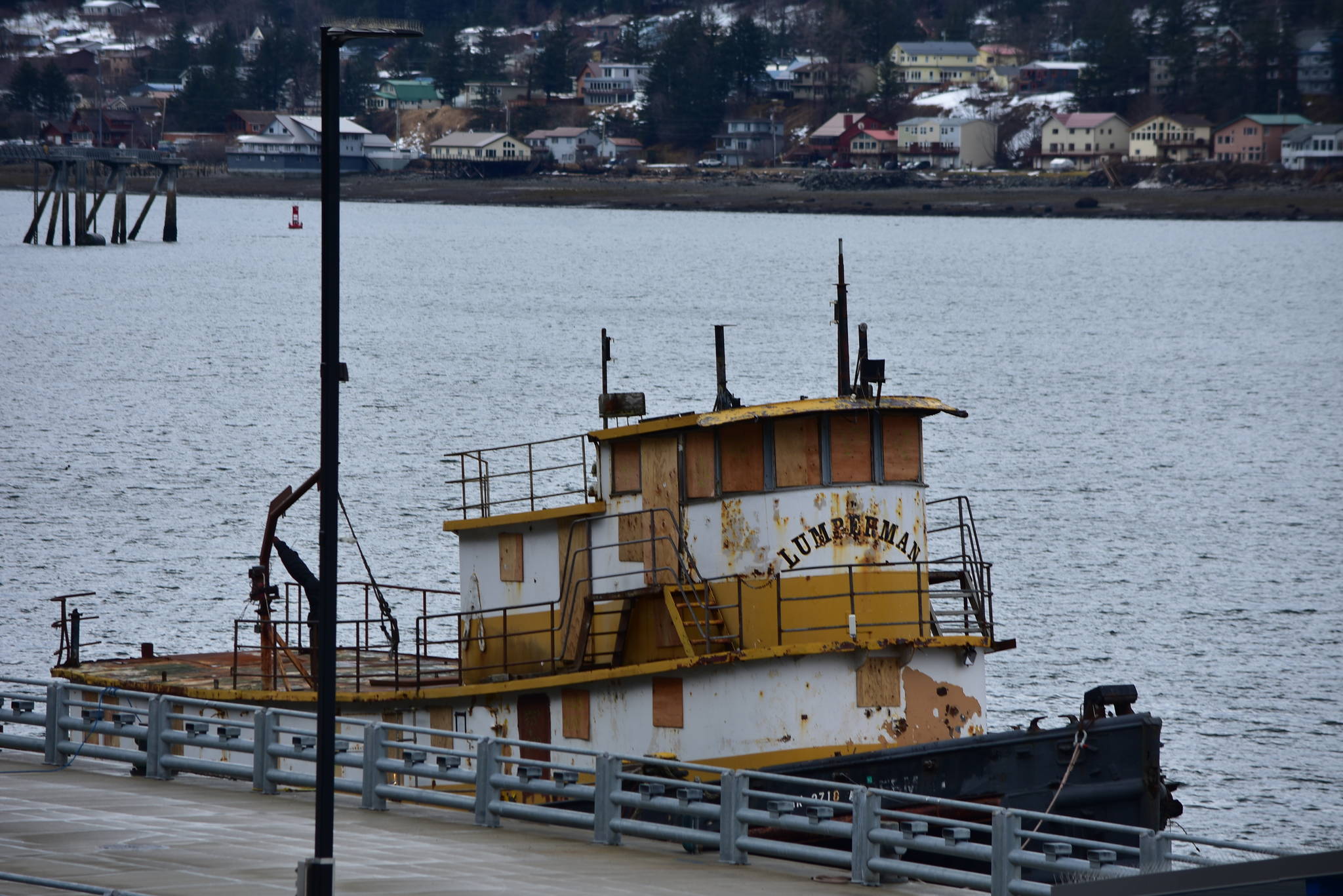The Lumberman, shown here moored alongside the City and Borough of Juneau’s pier downtown, will be scuttled in the open sea when clear weather allows. (Peter Segall / Juneau Empire File)