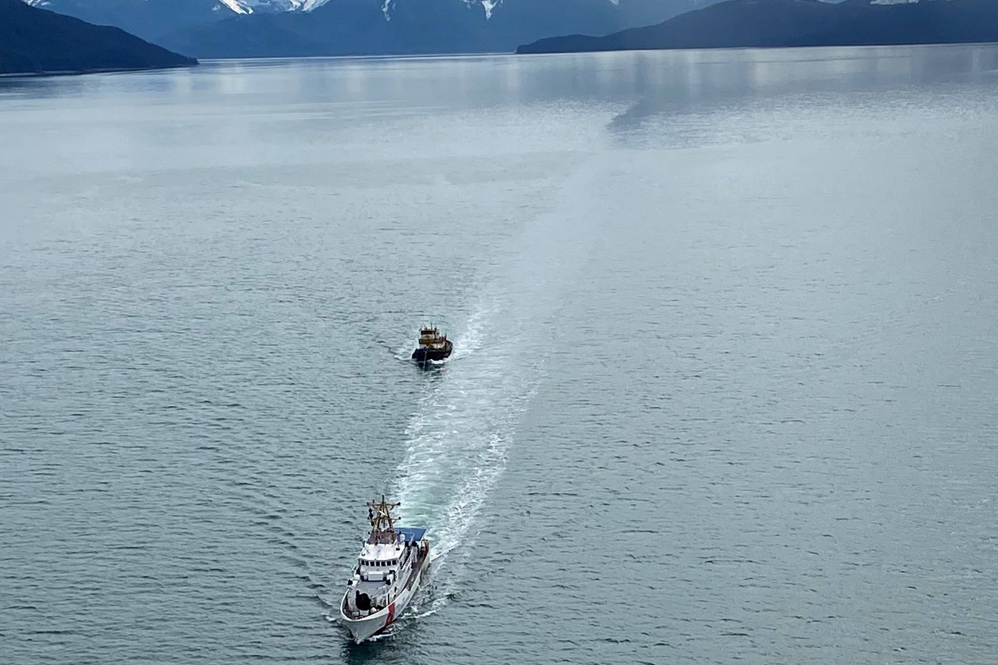 Coast Guard Cutter John McCormick, a 154-foot Sentinel–class vessel, towed the derelict tugboat Lumberman, to a position 54 miles west of Cross Sound, Alaska, on May 2, 2021. The decision to dispose of the Lumberman at sea, which had been abandoned in the Gastineau channel in 2016, was made after it was determined to be derelict and posed a significant public safety risk. (Courtesy photo / U.S. Coast Guard)