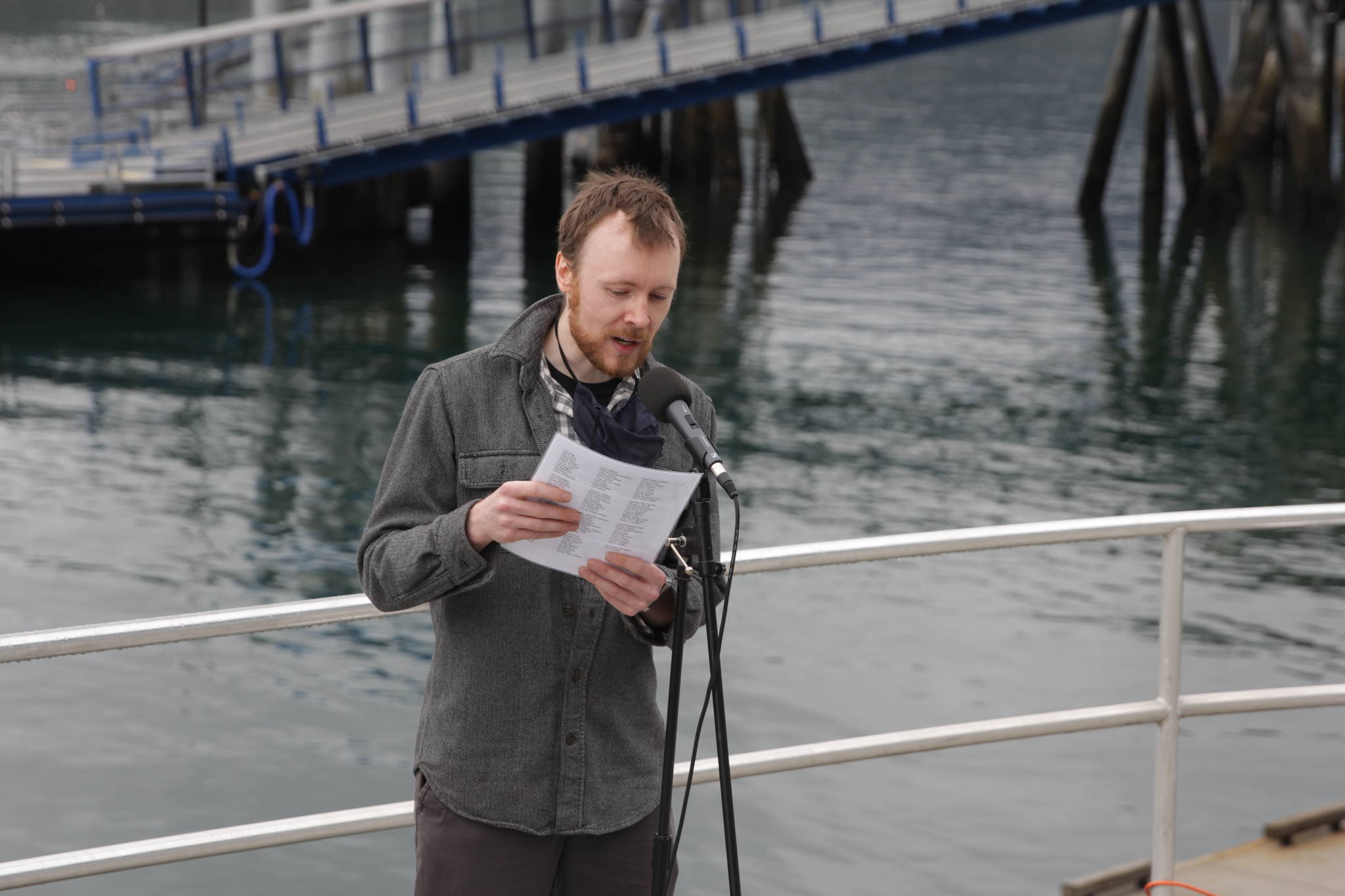 Carl Brodersen reads the names of those who died at sea during the 31st annual Blessing of the Fleet and Reading of Names at the Alaska Commercial Fishermen’s Memorial in Juneau on May 1, 2021. (Michael S. Lockett / Juneau Empire)