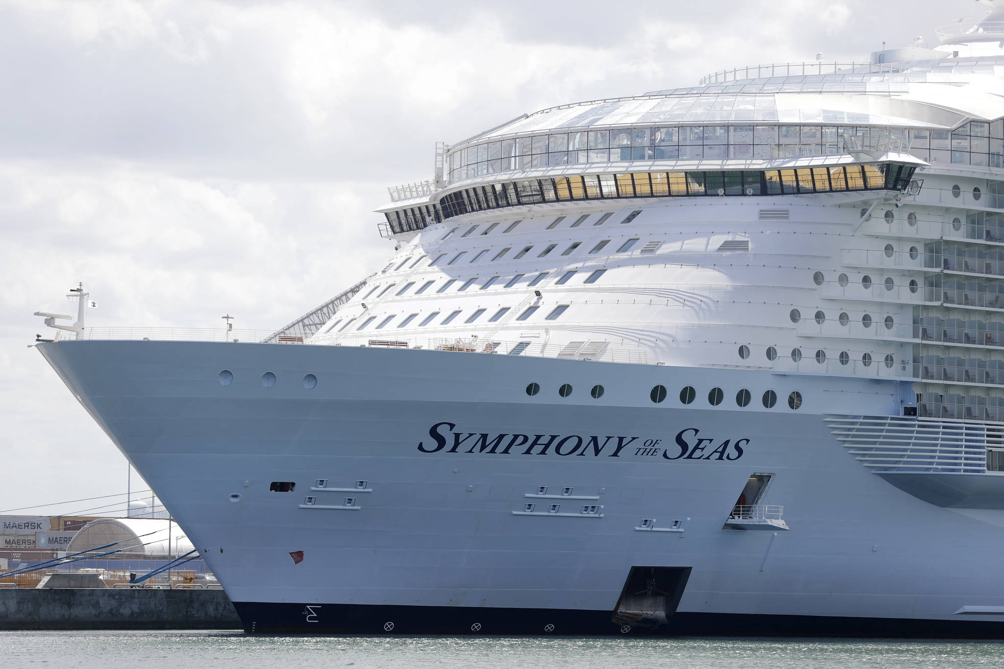 The Symphony of the Seas cruise ship is shown docked at PortMiami, in a Wednesday, May 20, 2020, photo, in Miami. Cruise lines can soon begin trial voyages in U.S. waters. They’ll have to carry some volunteer passengers, who will have to wear face masks and observe social distancing while on board. The Centers for Disease Control and Prevention gave ship operators final technical guidelines Wednesday, May 5, 2021 for the trial runs. (AP Photo / Wilfredo Lee)