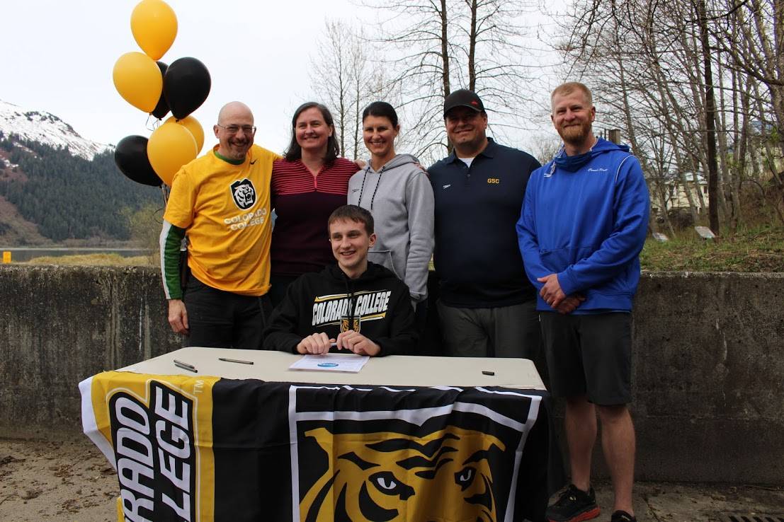 Caleb Peimann, surrounded by family and coaches, signs his letter of intent to swim for Colorado College in Colorado Springs, CO. (Courtesy photo / Scott Griffith)