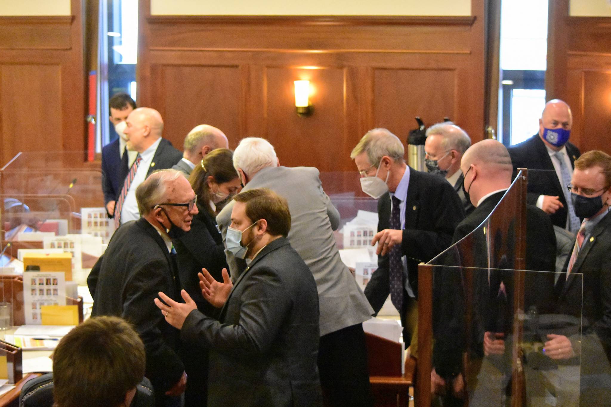 Lawmakers took a brief break from an all-day floor session Monday, May 10, 2021, when a plexiglass divider around a lawmakers desk fell over. Debate on the states operating budget bill covered a range of political issues beyond just funding. (Peter Segall / Juneau Empire)