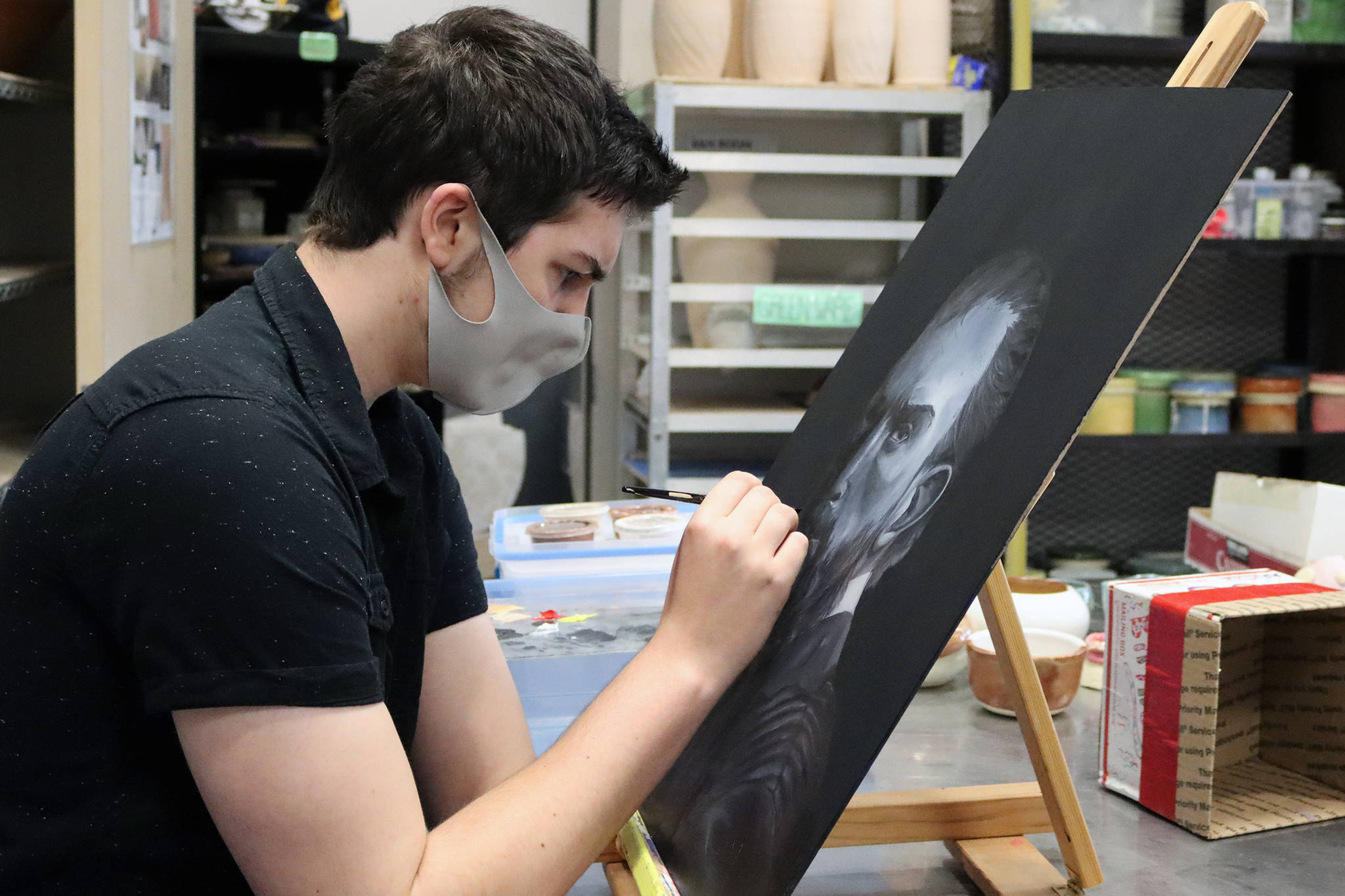 Garrett Klein, a rising senior at TMHS, works on a painting earlier this month. One of Klein’s pieces was awarded the Congressional Award in the 2021 All-State Art Competition and will hang in Washington, D.C. (Ben Hohenstatt / Juneau Empire)