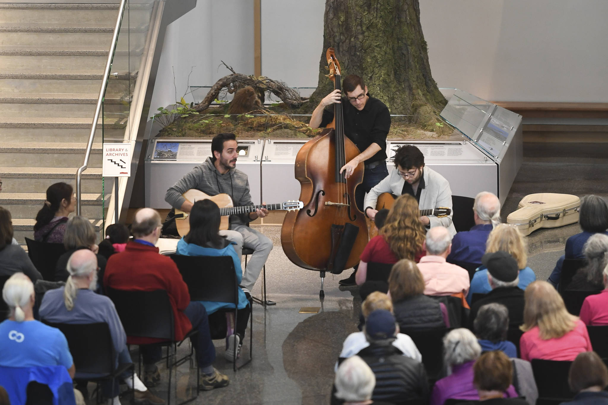 Members of the Gonzalo Bergara Trio perform in the atrium of the Andrew P. Kashevaroff Building as part of Juneau Jazz & Classics on Friday, May 10, 2019. The music festival continues through May 18. (Michael Penn | Juneau Empire)