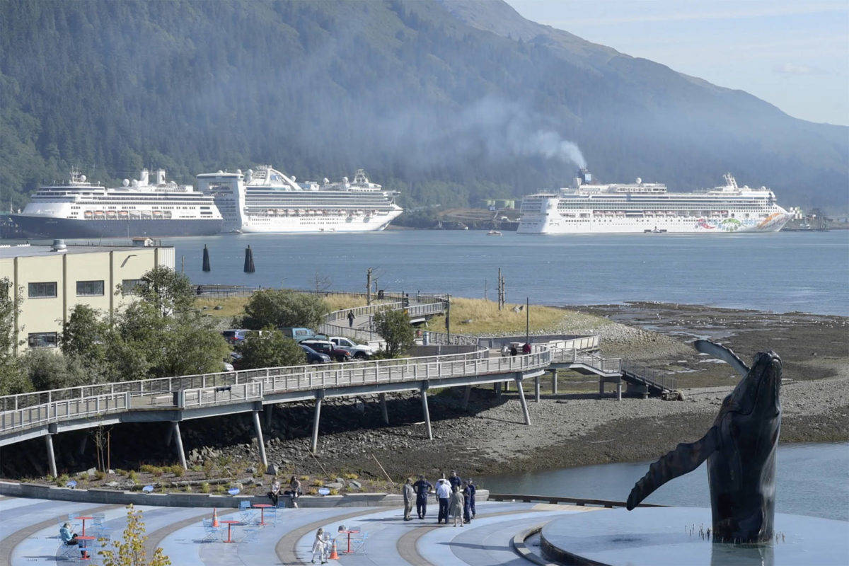 The Norwegian Pearl, right, pulls into the AJ Dock in Juneau in September 2018. Big-deck cruise ships may be seen in Juneau this year yet as a bill allowing them to bypass Canada passed in the U.S. House of Representatives on May 20, 2021. (Michael Penn/Juneau Empire File)