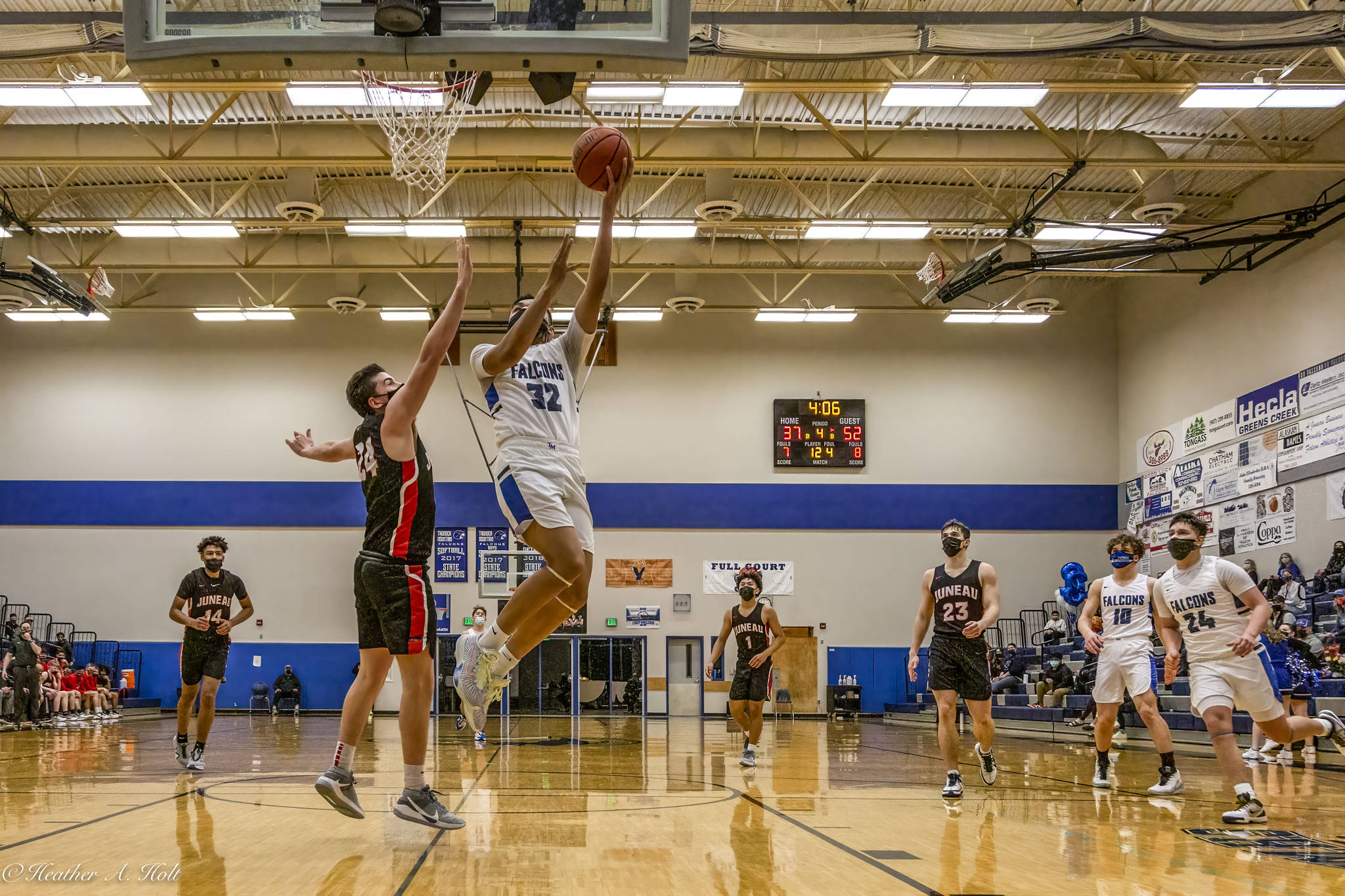 Thunder Mountain High School player Meki Toutaoilepo, battles for a basket. (Courtesy Photo/Heather Holt)