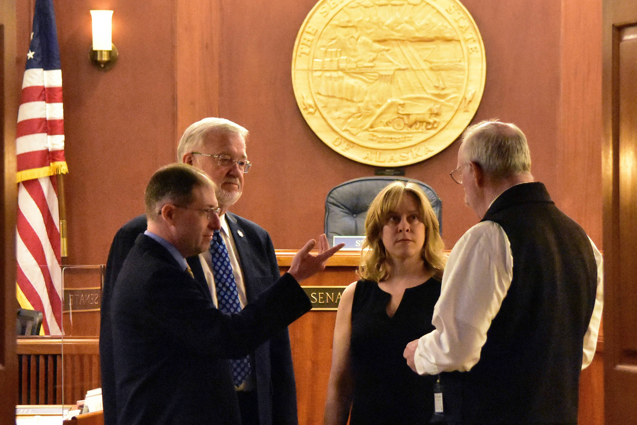 From left to right: Sens. Jesse Kiehl, D-Juneau; Gary Stevens, R-Kodiak; Mia Costello, R-Anchorage, and Bert Stedman, R-Sitka, speak on the floor of the Alaska Senate on Monday, May 24, 2021, the first day of one of two special sessions called by Gov. Mike Dunleavy. (Peter Segall / Juneau Empire)