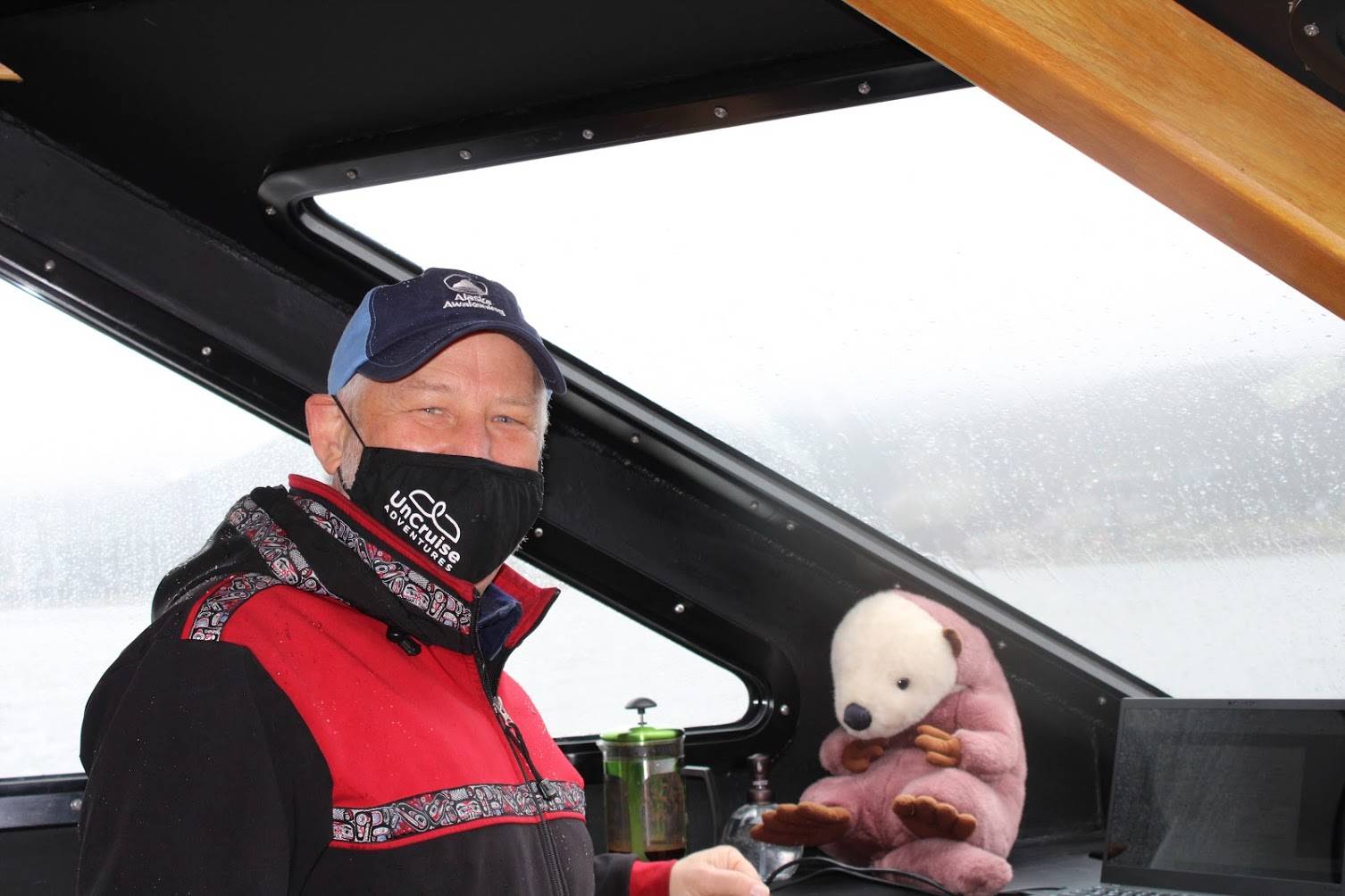 Dan Blanchard, CEO of UnCruise Adventures stands at the bridge of the Safari Quest, one of several boats that will ply Alaksa's waters this season. He said the stuffed animal is the ship's official mascot. His daughter, Denee Blanchard, is the captain of the vessel, which left Juneau for a weeklong cruise on May 15. (Dana Zigmund/Juneau Empire)