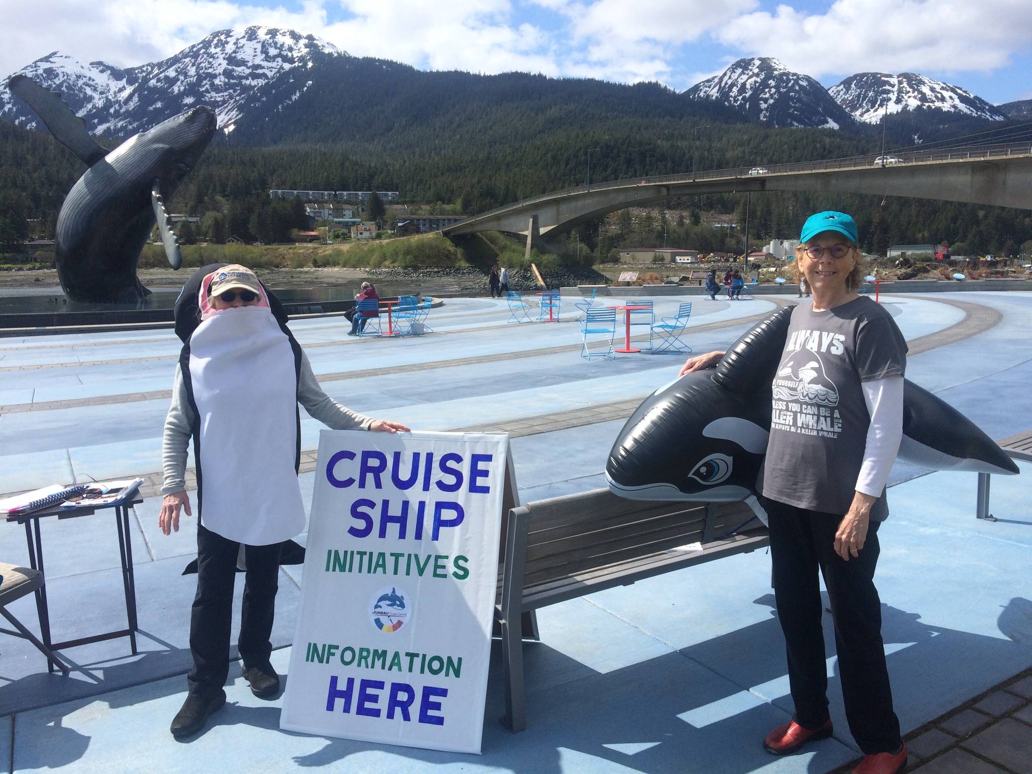 Pat White (left) and Sue Schrader (right), collect signatures to move a trio of initiatives aimed at curbing cruise ship visits to Juneau onto October's municipal ballot. The pair are members of a group called Juneau Cruise Control. With less than a week until the June 4 deadline to submit signatures for each question, organizers are not releasing the number of signatories to date. (Courtesy photo/Sue Schrader)
