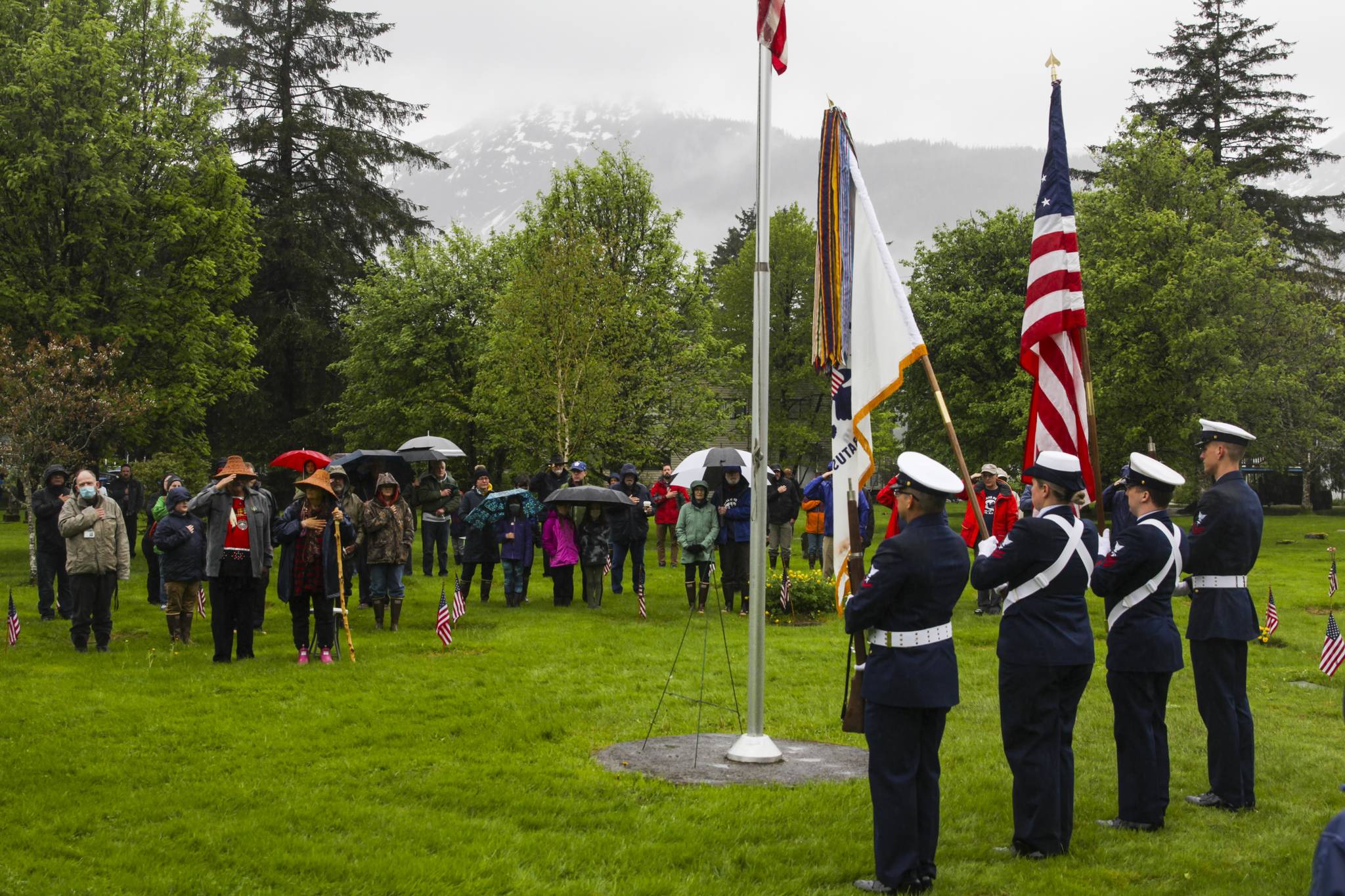 A Coast Guard color guard parades the colors at a Memorial Day ceremony held by the Veterans of Foreign Wars Post 5559 at Evergreen Cemetery on May 31, 2021. (Michael S. Lockett / Juneau Empire)