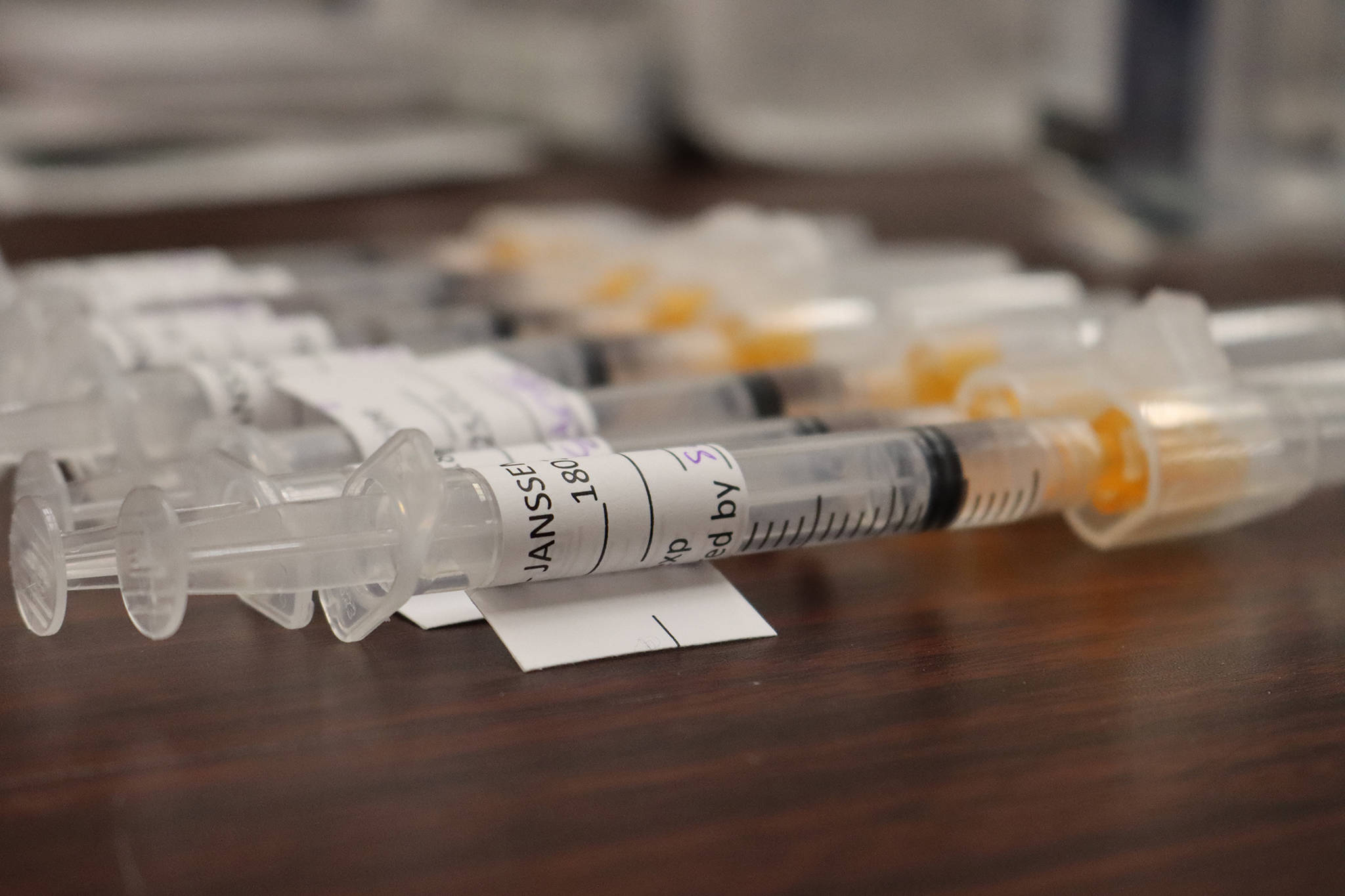 COVID-19 vaccines, like these seen at a March 13, 2021 Department of Veteran’s Affairs vaccine clinic, will be available at Alaska three main airports and open to anyone who wants one. (Ben Hohenstatt / Juneau Empire file)