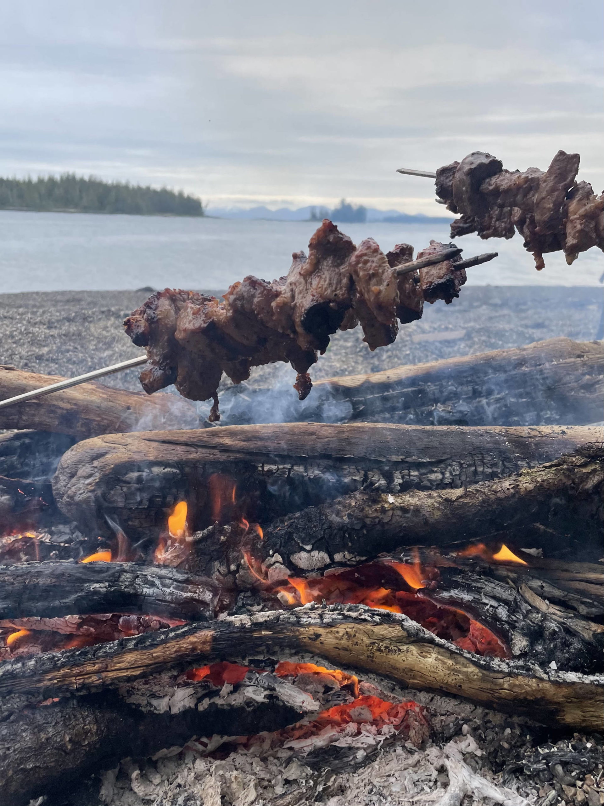 The author cooks steak over a beach fire over the Memorial Day weekend. (Jeff Lund / For the Juneau Empire)