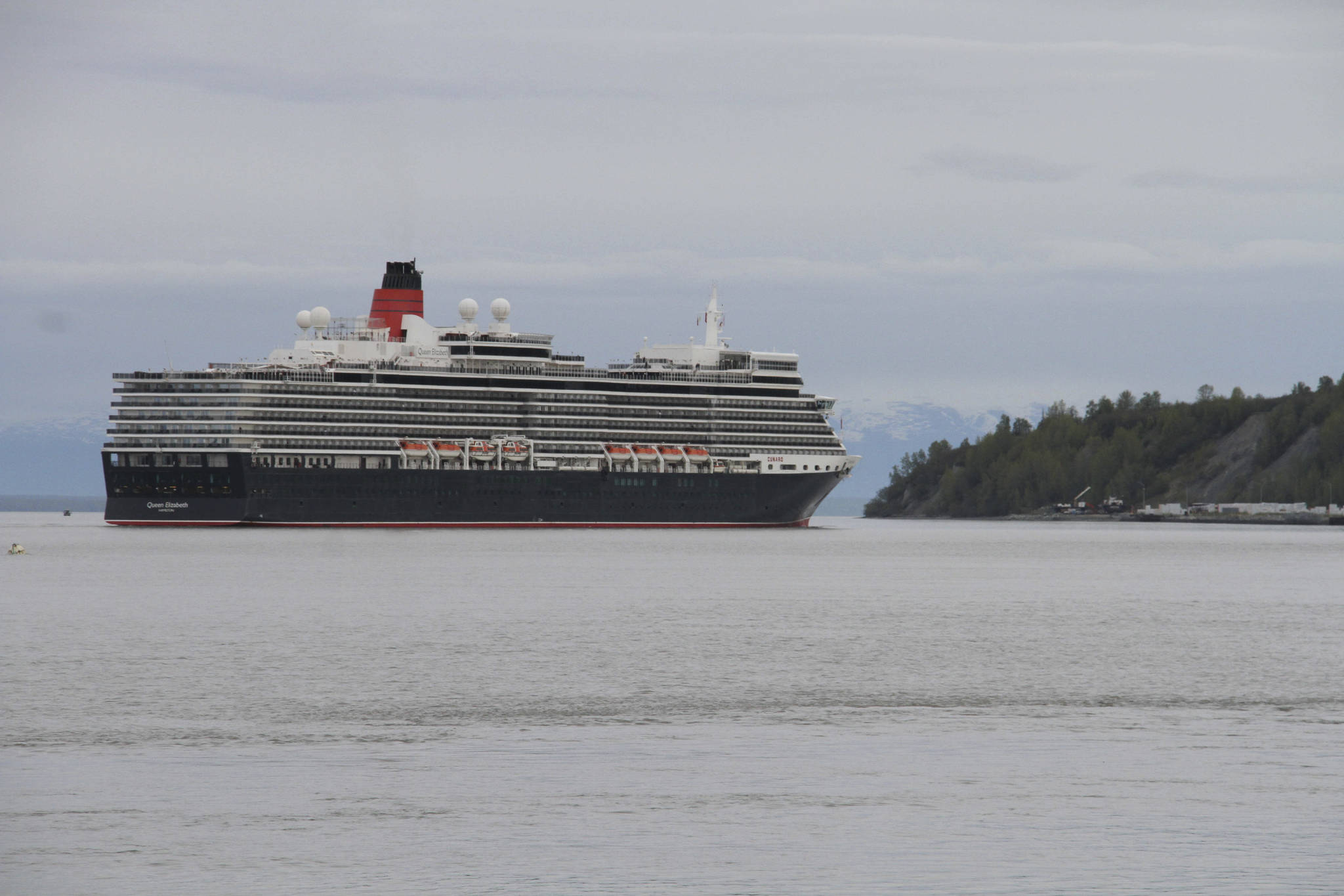 The Cunard cruise ship Queen Elizabeth sails through Cook Inlet Thursday, May 16, 2019, for a port call in Anchorage. Federal officials say a lawsuit in Florida could block cruise ships from visiting Alaska in summer 2021. (AP Photo / Mark Thiessen)