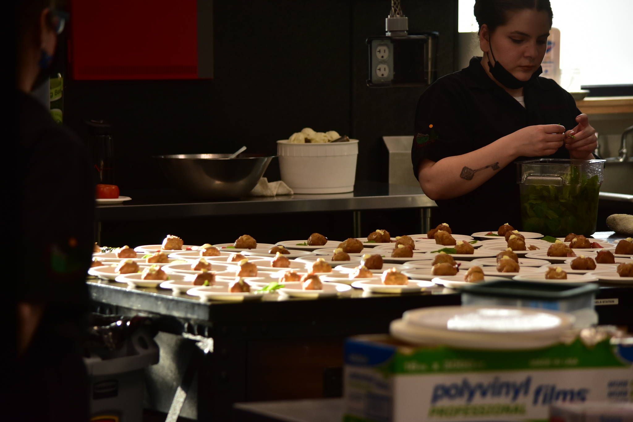 Red Spruce chefs prepare a dessert of New Orleans beignets with Alaskan foraged elderflower pastry cream, Alaskan devil’s club ice cream at a charity dinner highlighting Alaska and Louisiana seafood at Forbbiden Peak Brewery on Tuesday, June 8, 2021. (Peter Segall / Juneau Empire)