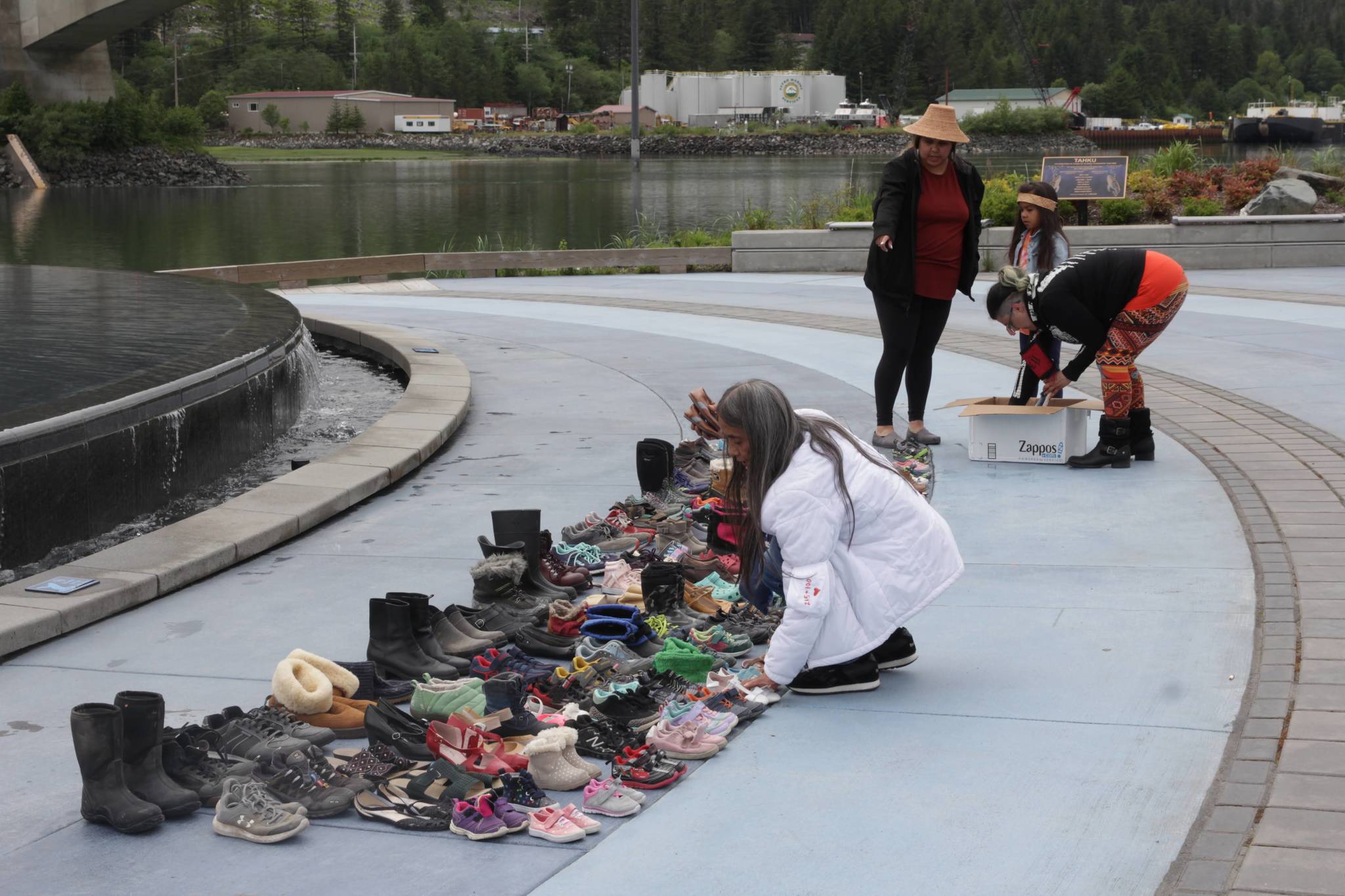 Juneau residents place hundreds of pairs of children's shoes in front of the state at Mayor Bill Overstreet Park on June 12, 2021 as they mourned for the 215 dead children uncovered at a residential school in Canada. (Michael S. Lockett / Juneau Empire)