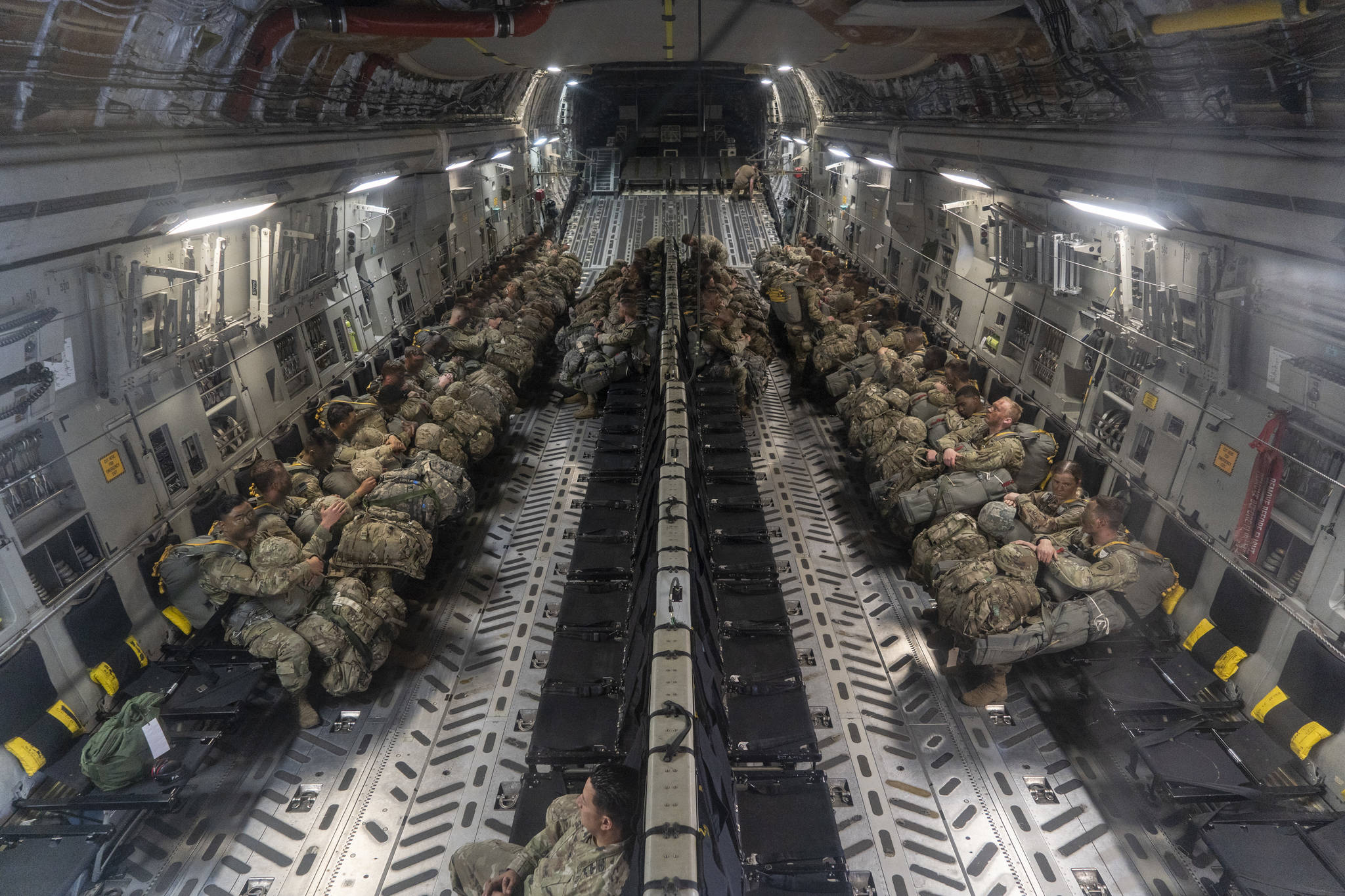 U.S. Army paratroopers assigned to the 1-40th Cavalry, 1st Squadron (Airborne), 25th Infantry Division prepare to jump at Donnelly training area in support of RED FLAG-Alaska on June 17th, 2021. (Airman 1st Class Mario Calabro / U.S. Air Force)