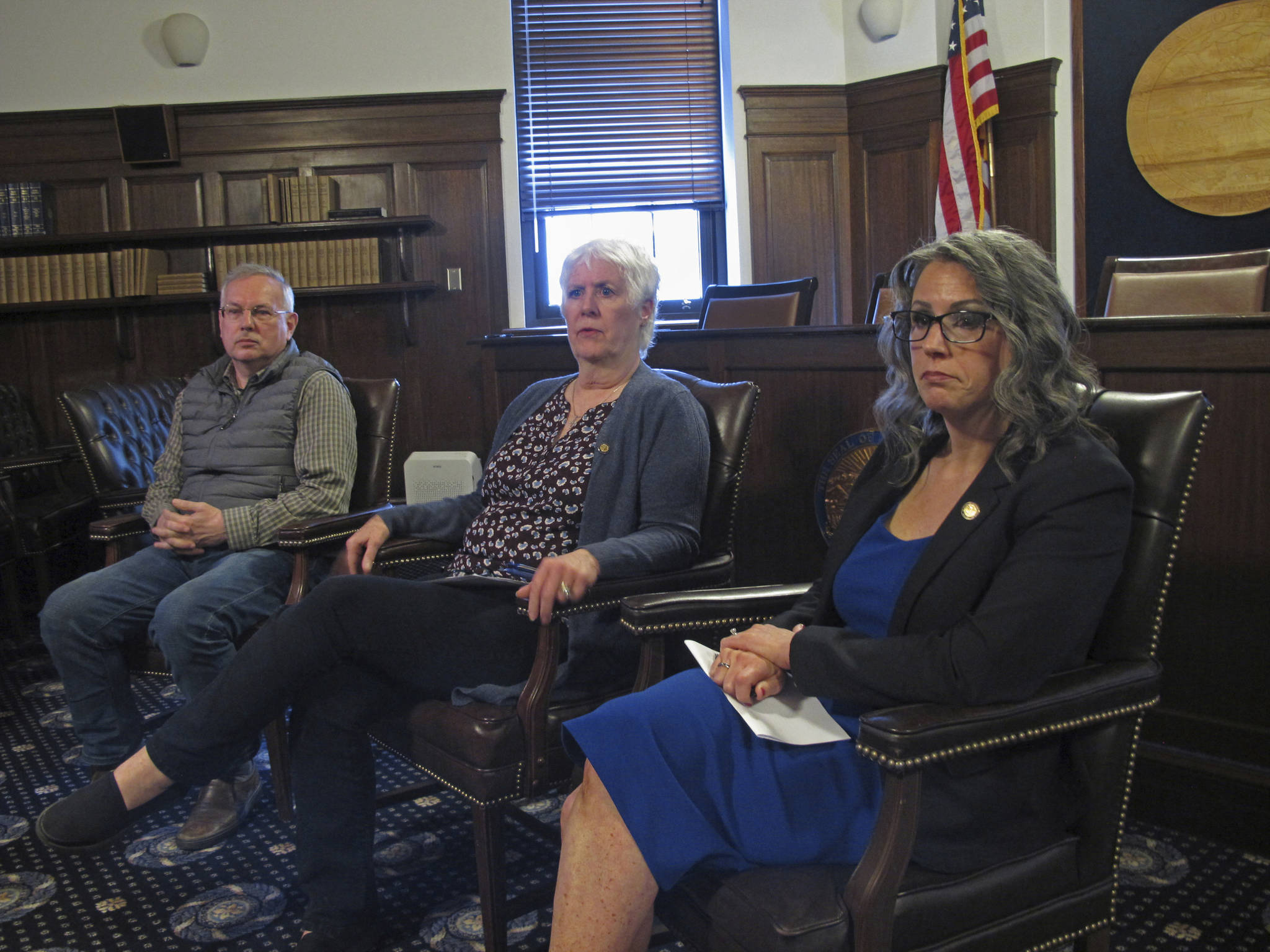 Alaska House Speaker Louise Stutes (center), along with leaders of the House majority coalition, Rep. Bryce Edgmon (left) and Rep. Kelly Merrick (right) speak to reporters on the final day of a special legislative session on Friday. The special legislative session limped toward a bitter end Friday, with Alaska Gov. Mike Dunleavy and House majority leaders sharply disagreeing over the adequacy of the budget passed by lawmakers earlier this week. (AP Photo/Becky Bohrer)