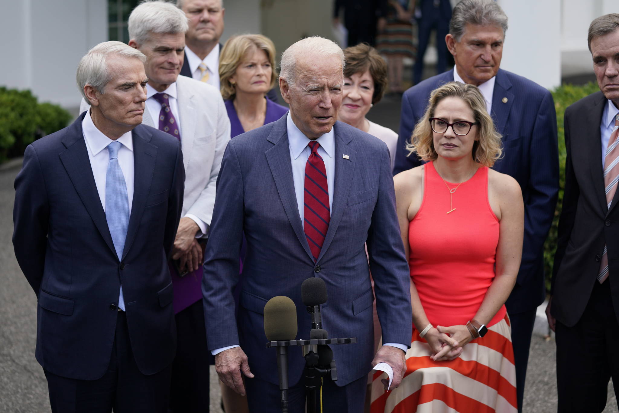 President Joe Biden, with a bipartisan group of Senators, including Alaska’s Lisa Murkowski, speaks Thursday June 24, 2021, outside the White House in Washington. Biden invited members of the group of 21 Republican and Democratic senators to discuss the infrastructure plan. (AP Photo / Evan Vucci)