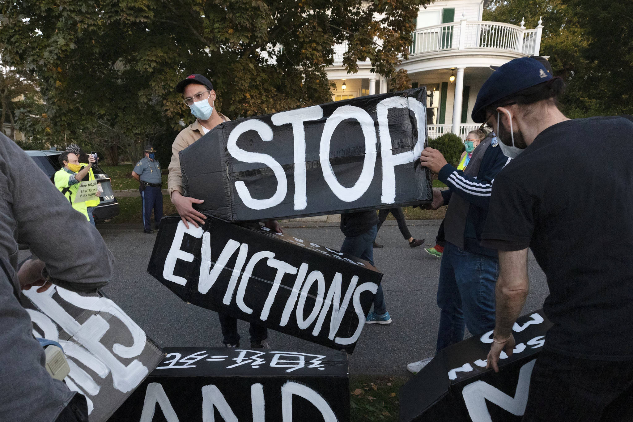 In this October 2020 photo, housing activists erect a sign in Swampscott, Mass. A federal freeze on most evictions is set to expire soon. The moratorium, put in place by the Centers for Disease Control and Prevention in September, was the only tool keeping millions of tenants in their homes. (AP Photo / Michael Dwyer)