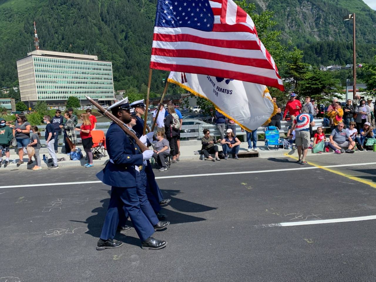 Coast Guardsmen march in the Juneau Fourth of July parade on July 4, 2021. (Dana Zigmund / Juneau Empire)