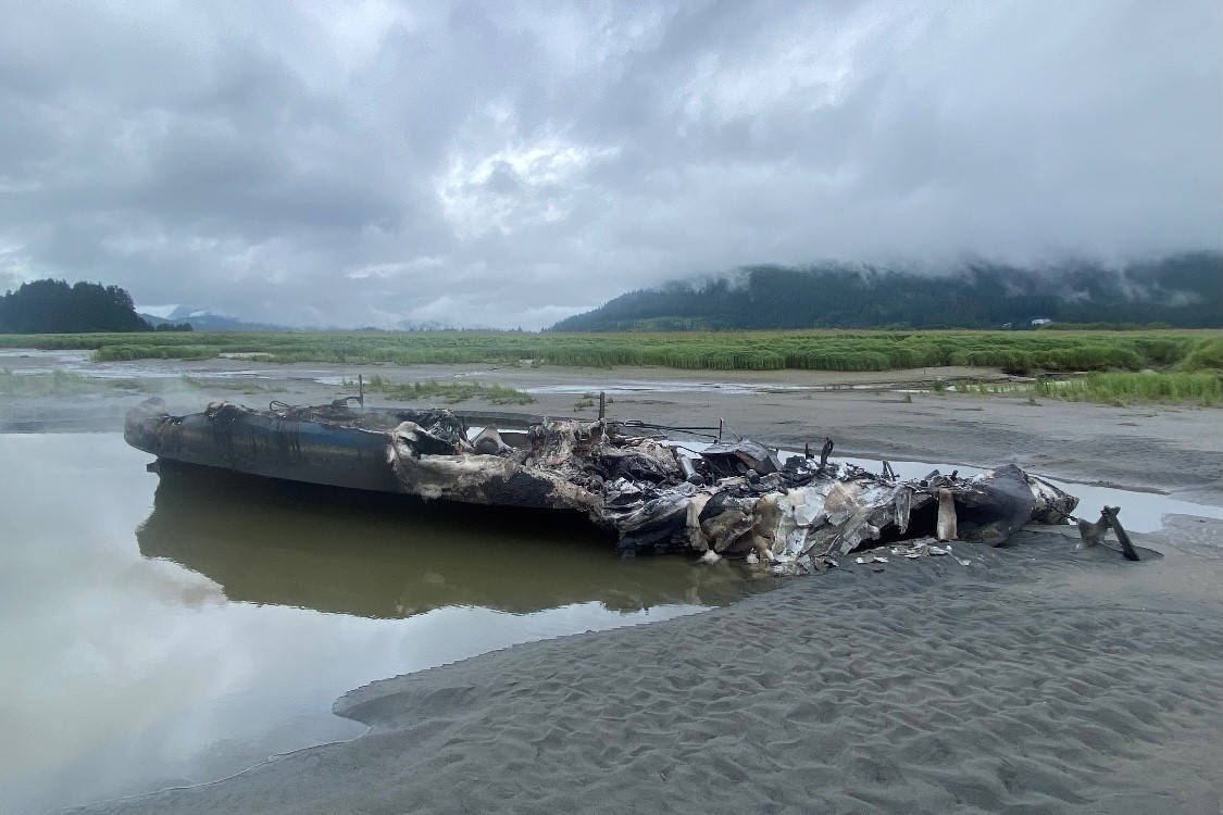 The commercial fishing vessel Della G, seen here the next morning, caught fire and was completely destroyed in the Gastineau Channel on Tuesday, July 13, 2021. (U.S. Coast Guard / Petty Officer 2nd Class Steven Knight)