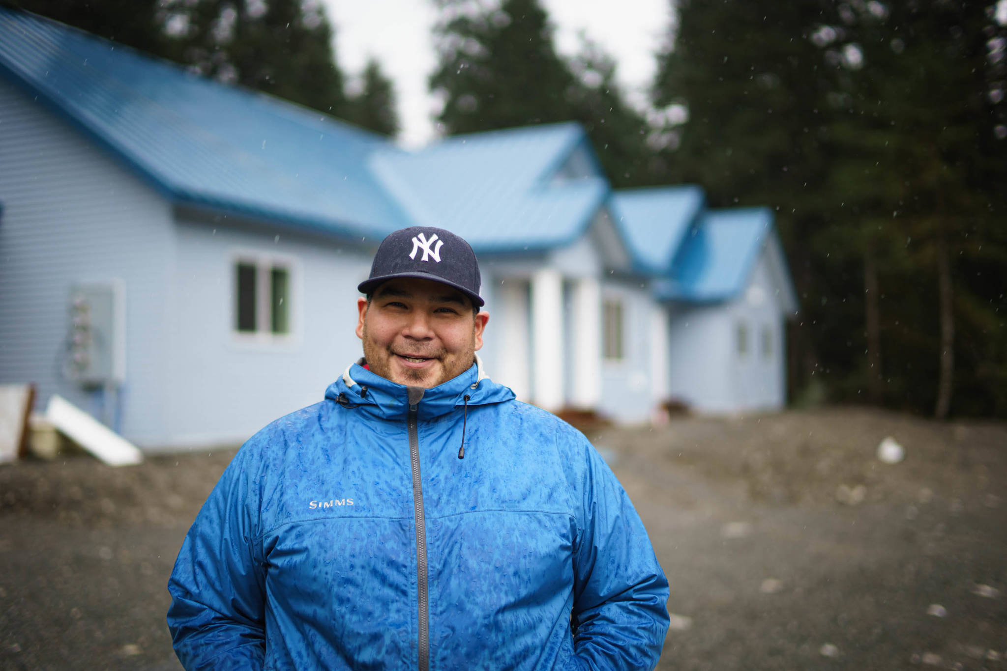 Ralph Wolfe is the Program Director for the Sustainable Southeast Partnership. Pictured here in front of an affordable housing complex he helped catalyze with the Yakutat Tlingit Tribe through the SSP in 2018. (Courtesy Photo / Bethany Sonsini Goodrich)