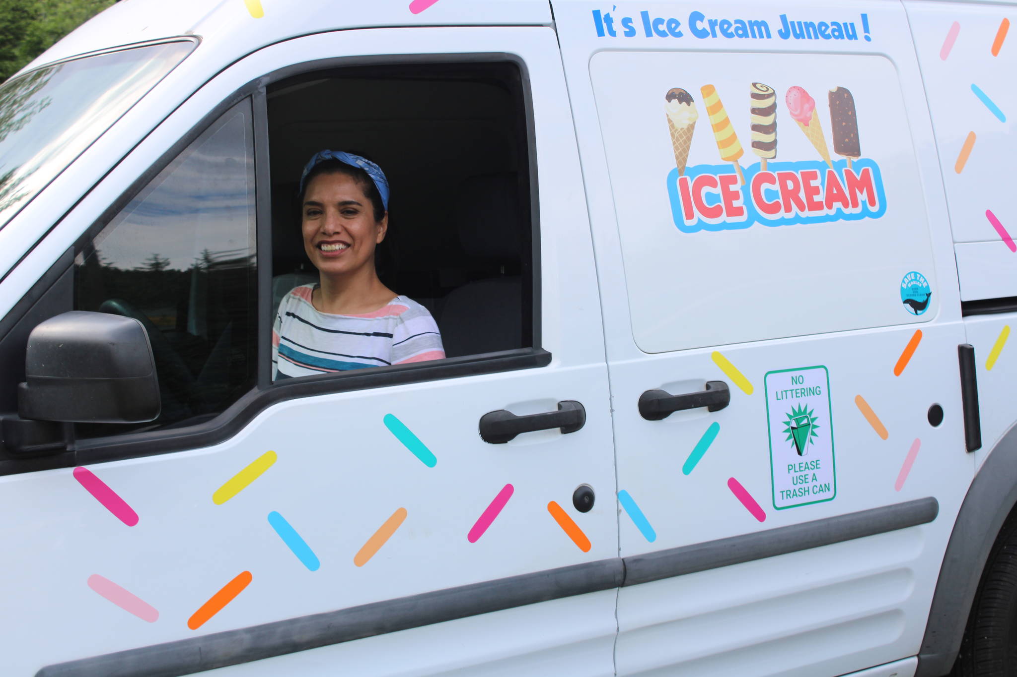 Cathy Mendoza sits in the driver’s seat of her ice cream truck on July 18. She recently launched the ice cream truck business in Juneau. She said that despite the concept being new to Juneau, sales have been brisk. (Dana Zigmund/Juneau Empire)