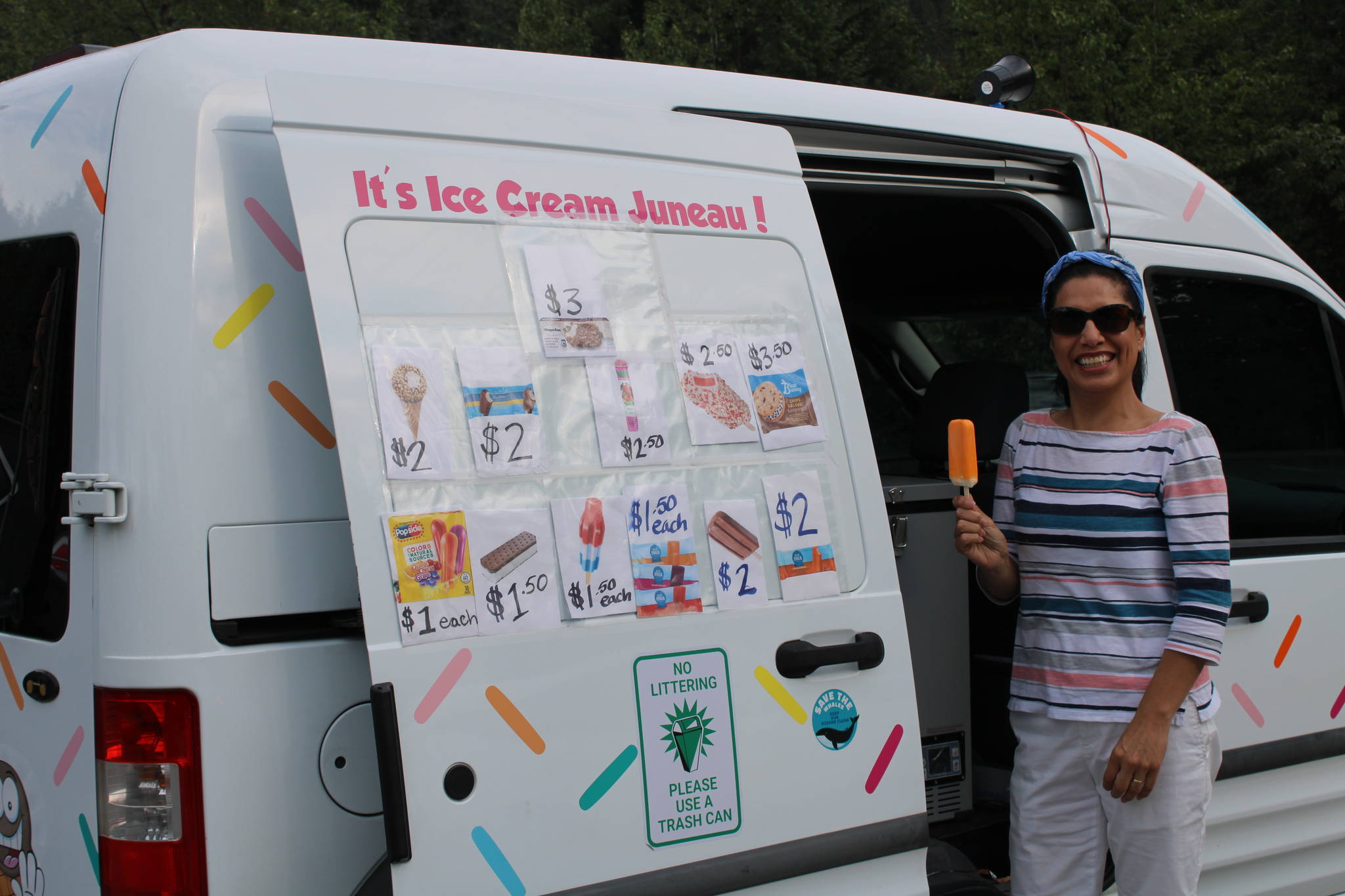 Cathy Mendoza shows off her wares on July 18. She said the best part of operating an ice cream truck is seeing children lined up and excited to see her approach. (Dana Zigmund/Juneau Empire)