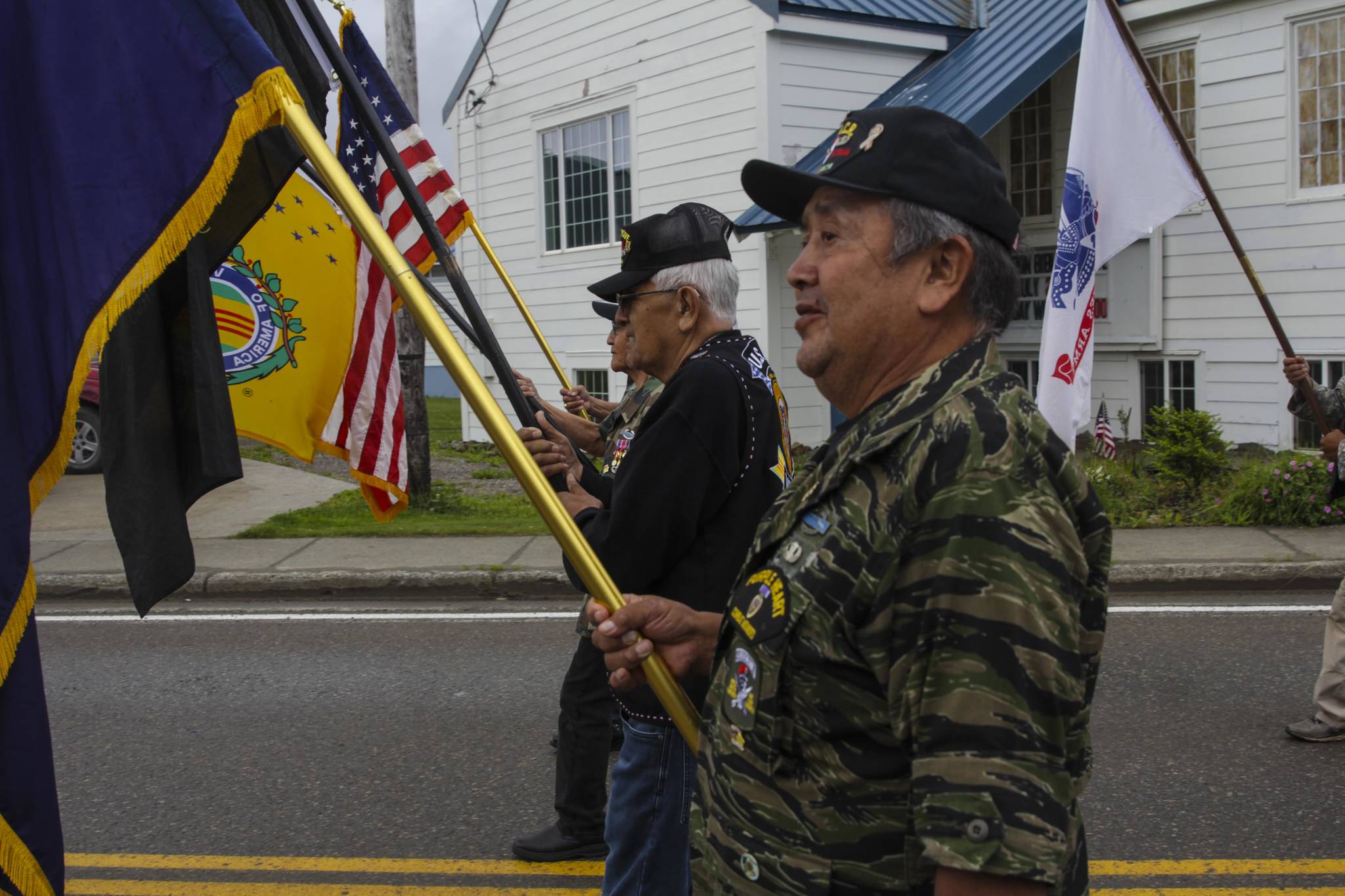 Veterans parade the colors on July 24, 2021 as hundreds gathered in Hoonah for the raising of a totem pole honoring veterans of the armed services. (Michael S. Lockett / Juneau Empire)