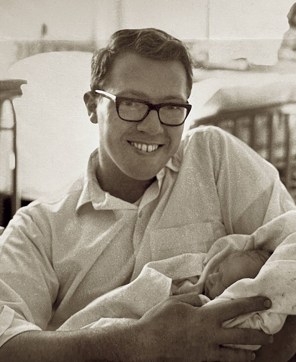 Neal Brown in 1967, holding his newborn son Kris. (Courtesy Photo / Kris Brown)