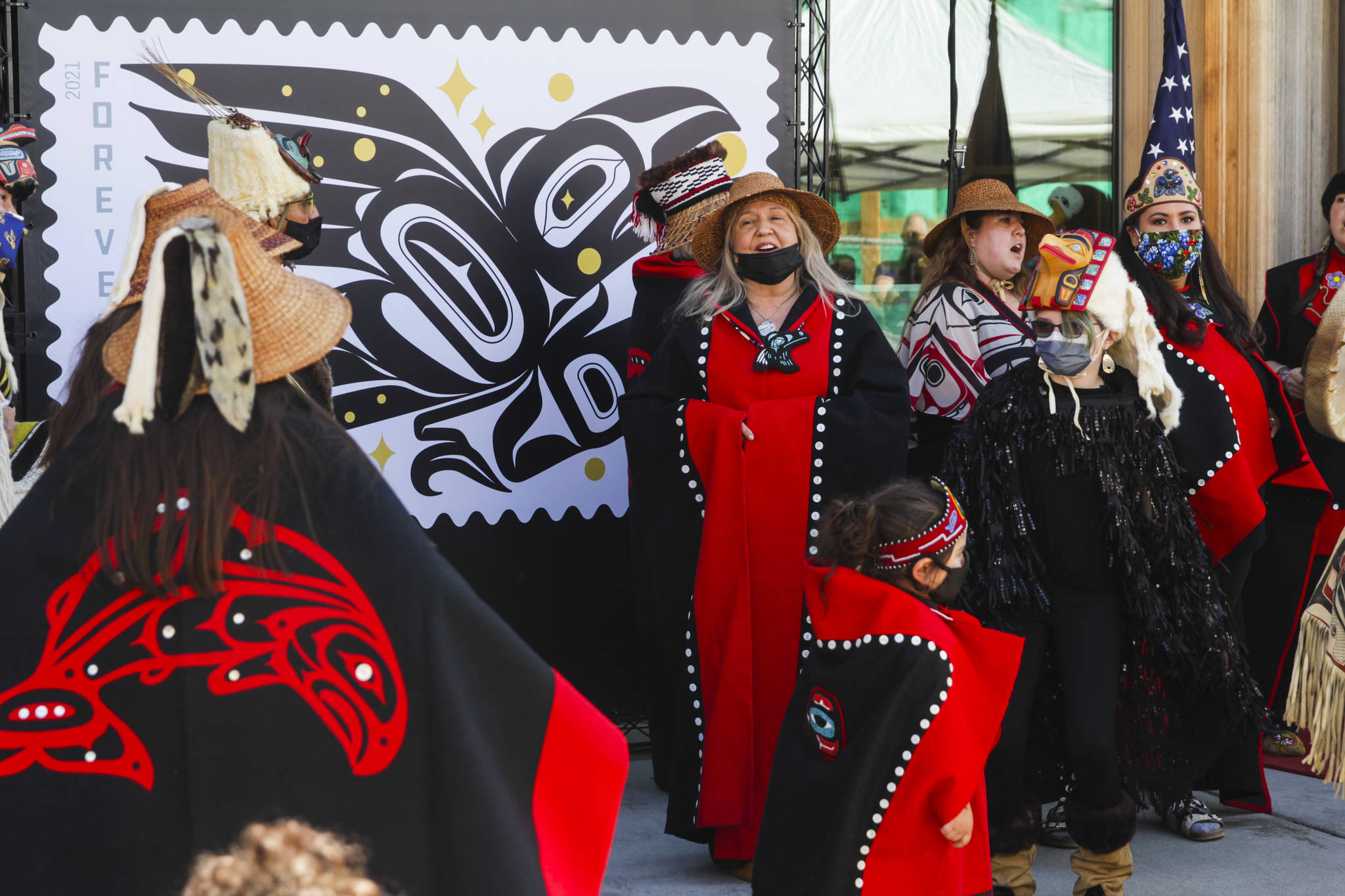 Michael S. Lockett / Juneau Empire 
Dancers perform during an official release ceremony for the Raven Story stamp in front of the Sealaska Heritage Institute’s Walter Soboleff Building on Friday, July 30, 2021.