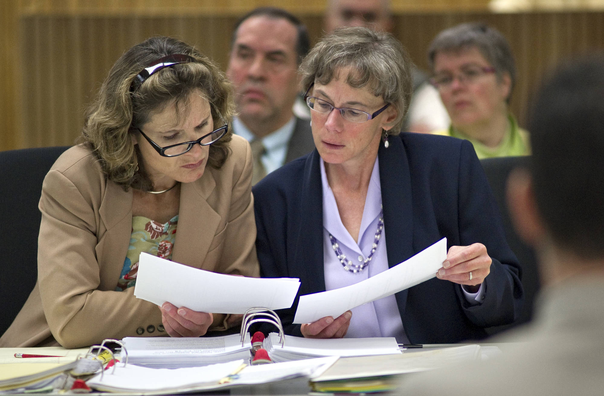 Mila Cosgrove, right, who retired from her position as Deputy City Manager of the City and Borough of Juneau, received a commendation from the CBJ Assembly Monday night for her years of service to the city. This August 2011 file photo shows Cosgrove in her former position as CBJ Human Resources and Risk Management Director alongside former City Attorney Jane Sebens. (Michael Penn / Juneau Empire File)