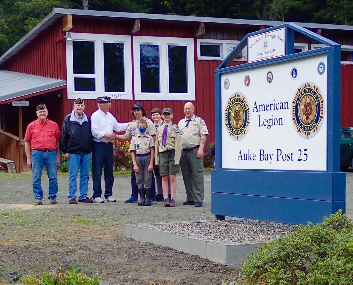 Courtesy photo / Tom Dawson 
Eagle Scout Kristofer Ely and American Legion Post Commander Tom Dawson shake hands at the unveiling of the new sign outside Auke Bay Post 25. Ely executed a project replacing the old sign with the new one.