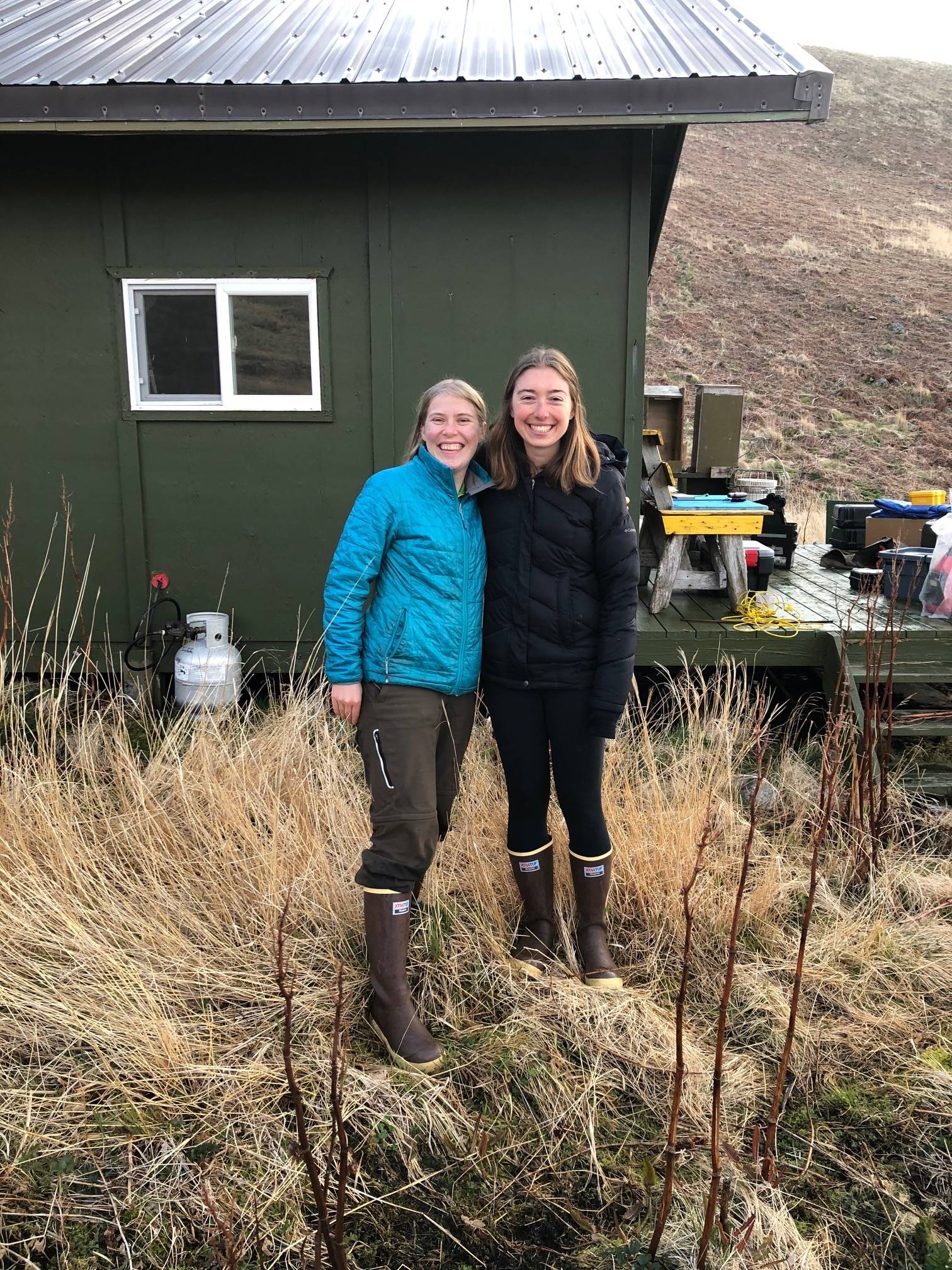 Biologists Briana Bode, left, and Katie Stoner as they were dropped off at their cabin on Chowiet Island in May 2021. The women recently experienced a magnitude 8.2 earthquake there, not far from the epicenter.(Courtesy Photo / Heather Renner, Alaska Maritime National Wildlife Refuge)