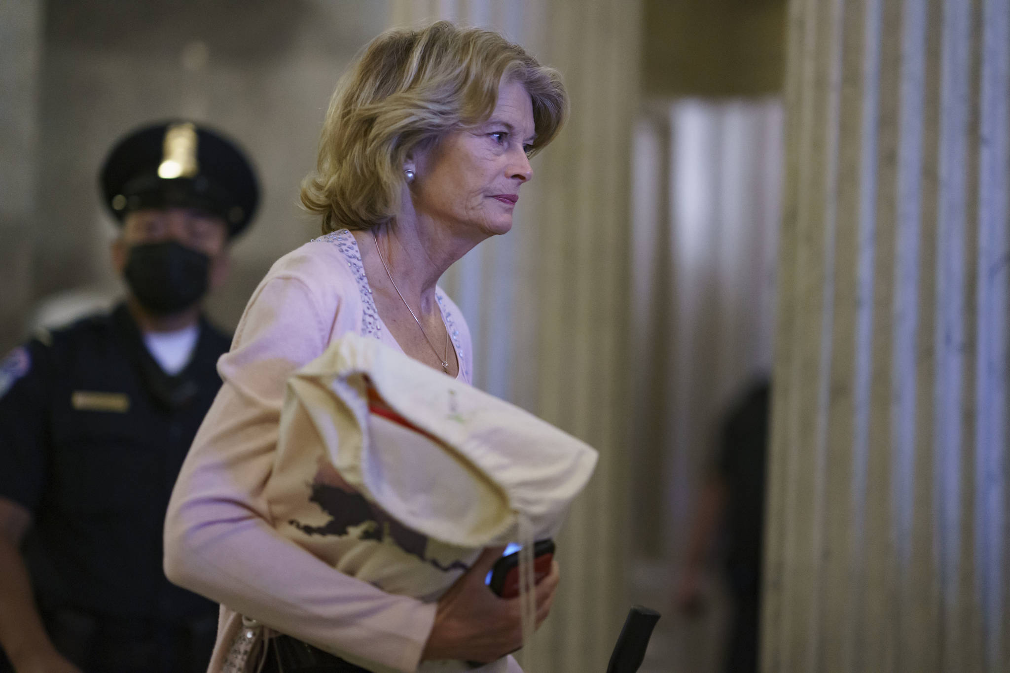 Sen. Lisa Murkowski, R-Alaska, one of the key Senate Republicans who negotiated the $1 trillion bipartisan infrastructure bill with Democrats, departs after a procedural vote on the measure, at the Capitol in Washington, Saturday, Aug. 7, 2021. More votes will be needed before final Senate passage. (AP Photo / J. Scott Applewhite)