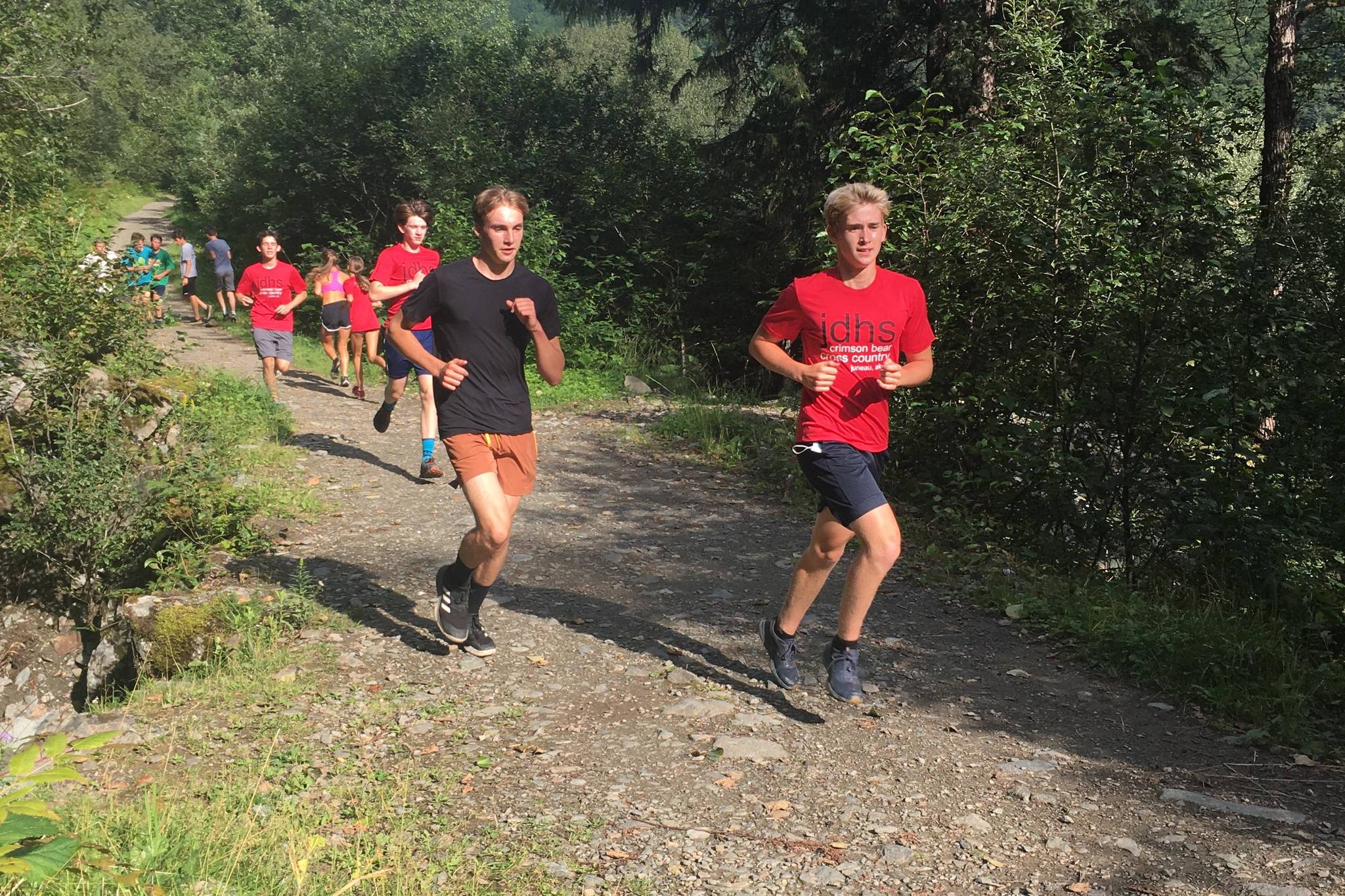 Runners from the Juneau-Douglas High School: Yadaa.at Kalé cross country team practice during the preseason. (Courtesy photo / Tristan Knutson-Lombardo)
