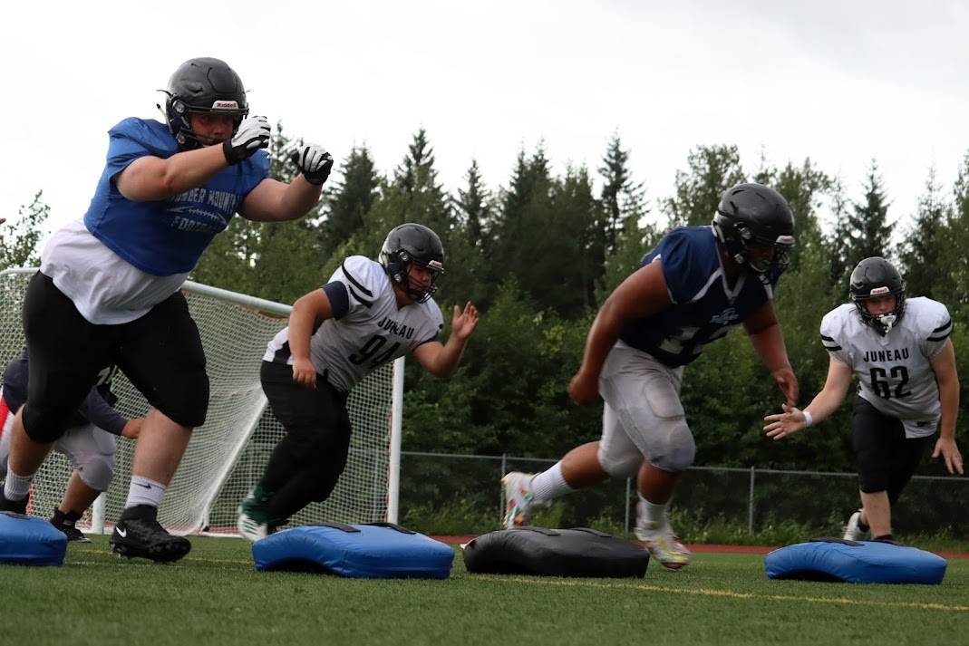 Members of the Juneau Huskies practice on Tuesday. After COVID-19 forced the cancelation of the 2020 high school football season, the Juneau Huskies are eager to take the field for the season opener against Colony High School. The varsity and JV squad will both play Saturday, August 14 on the field at Adair-Kennedy Memorial Park. (Ben Hohenstatt/Juneau Empire)