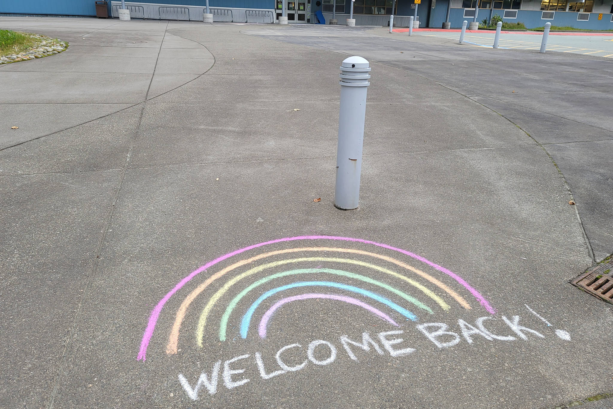 A sidewalk-based message welcomes students and staff back to Sít’ Eetí Shaanàx-Glacier Valley School ahead of the first day of school on Monday, Aug. 16.