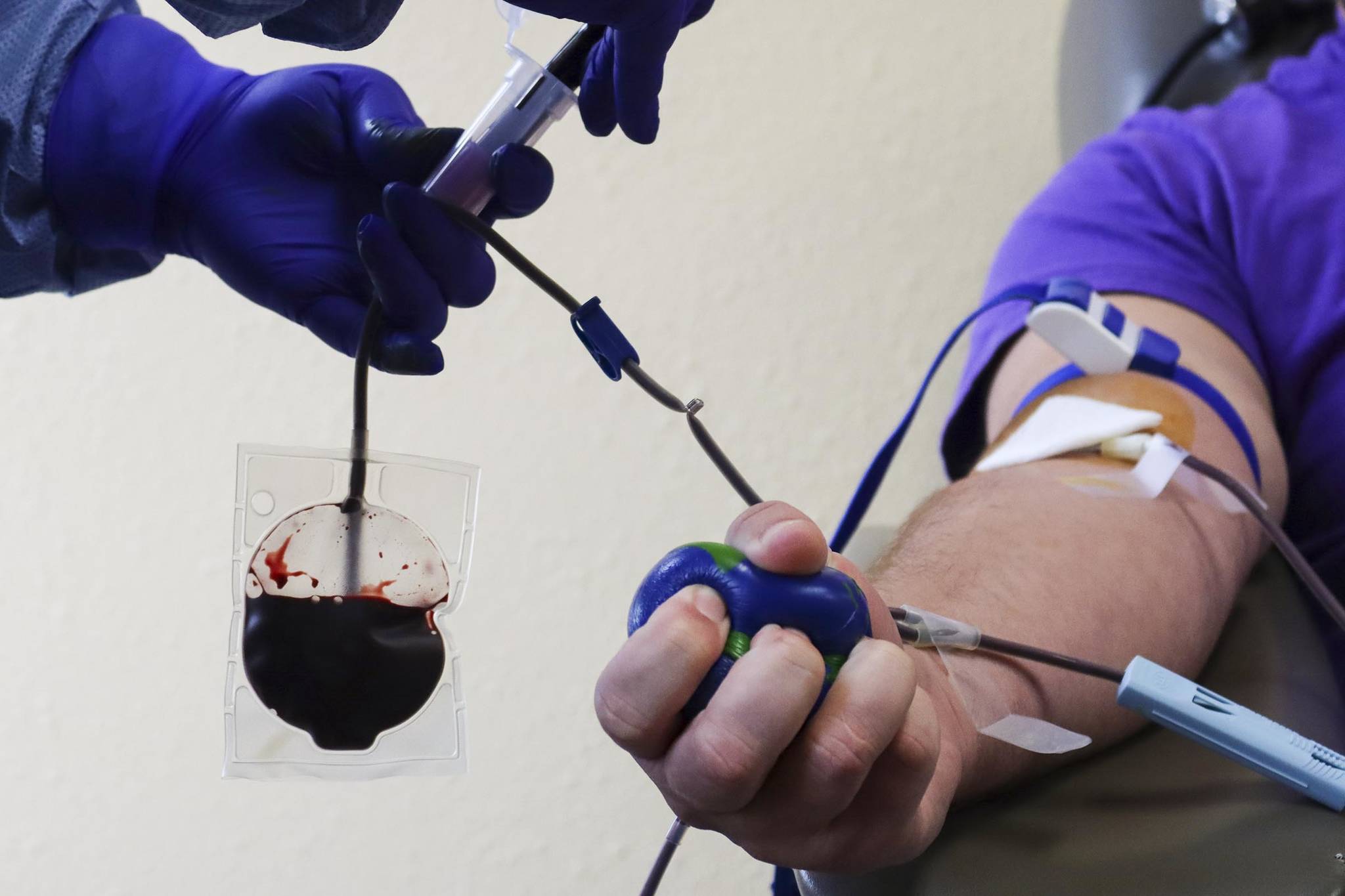 A donor gives blood at the Blood Bank of Alaska’s Juneau center on Aug. 18, 2021. The BBA is currently experiencing critical shortages of multiple blood types statewide. (Ben Hohenstatt / Juneau Empire)