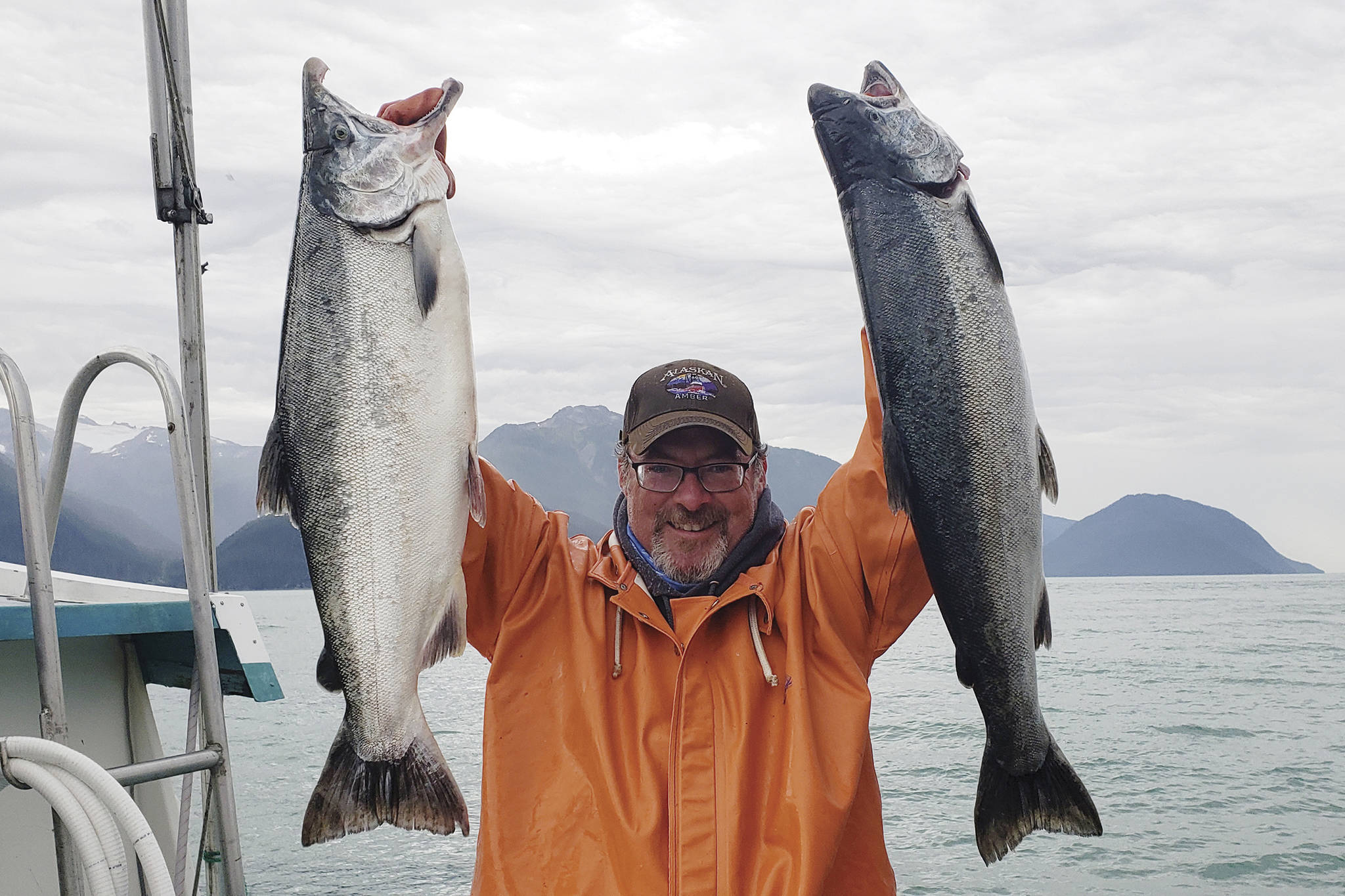 Hank Shaw holds coho salmon caught on the Taku River. Shaw, a hunter, angler, gardener, chef and award-winning writer, is in town this week to promote his new book "Hook, Line and Supper." (Courtesy Photo / Holly A. Heyser)