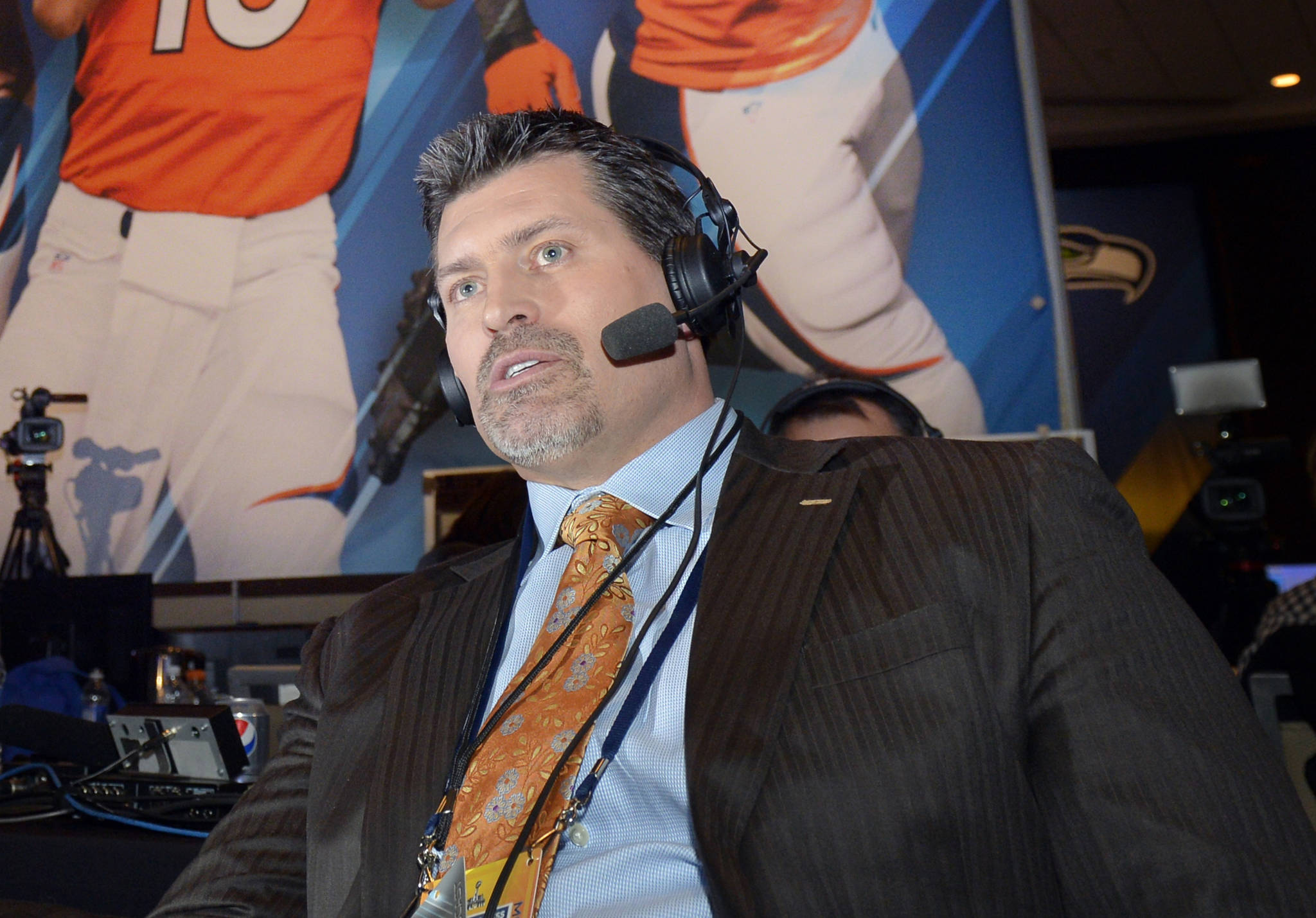 FILE - This Jan. 29, 2014 file photo shows former Denver Broncos offensive lineman and ESPN analyst Mark Schlereth in New York.   Schlereth returned home to Alaska this week to encourage people to get the COVID-19 vaccine.  The Service High alumnus made a halftime appearance Friday, Aug. 20, 2021 at West High, where his alma mater squared off against the West Eagles.  (AP Photo / Jack Dempsey)