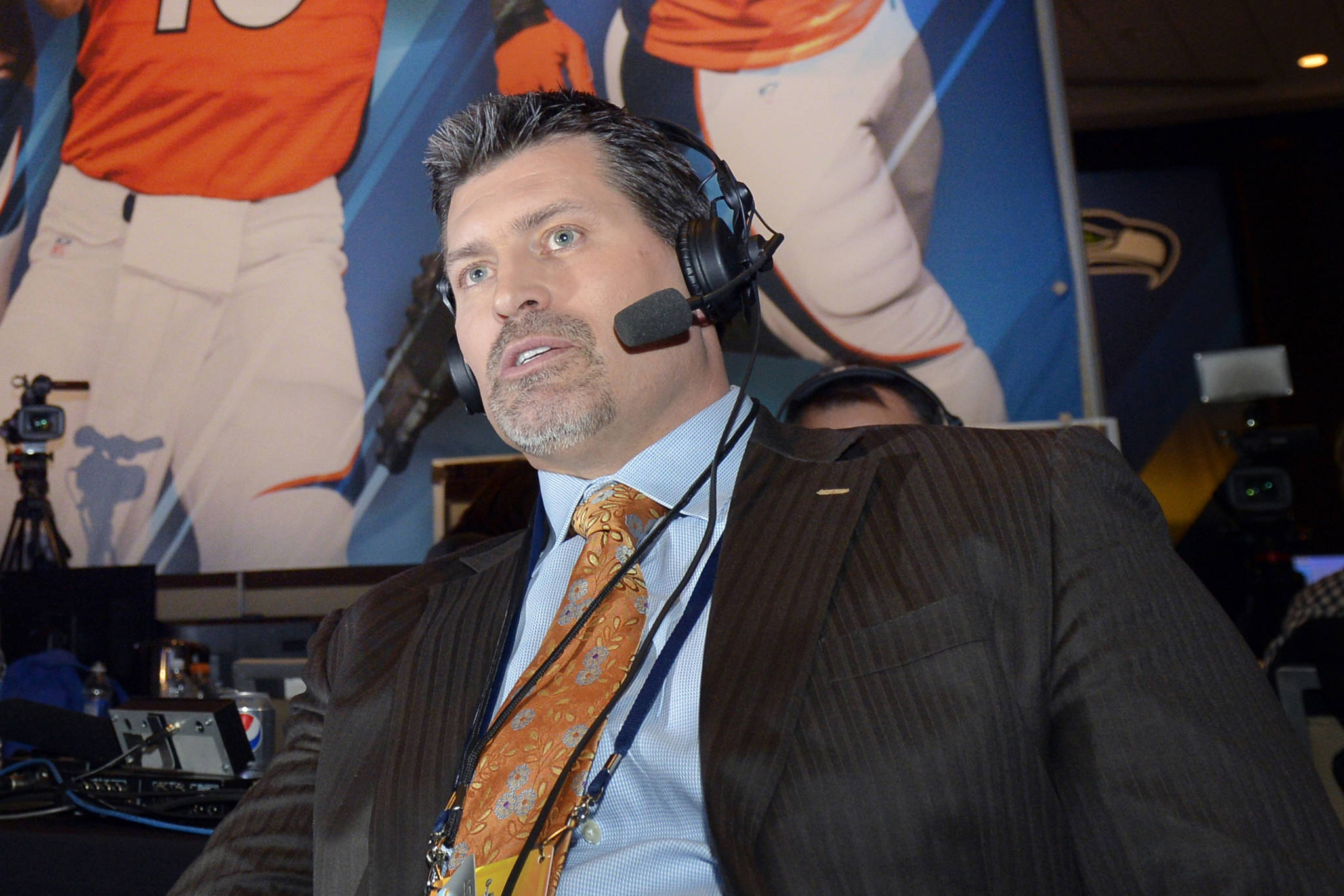 FILE - This Jan. 29, 2014 file photo shows former Denver Broncos offensive lineman and ESPN analyst Mark Schlereth in New York.   Schlereth returned home to Alaska this week to encourage people to get the COVID-19 vaccine.  The Service High alumnus made a halftime appearance Friday, Aug. 20, 2021 at West High, where his alma mater squared off against the West Eagles.  (AP Photo/Jack Dempsey, File)
