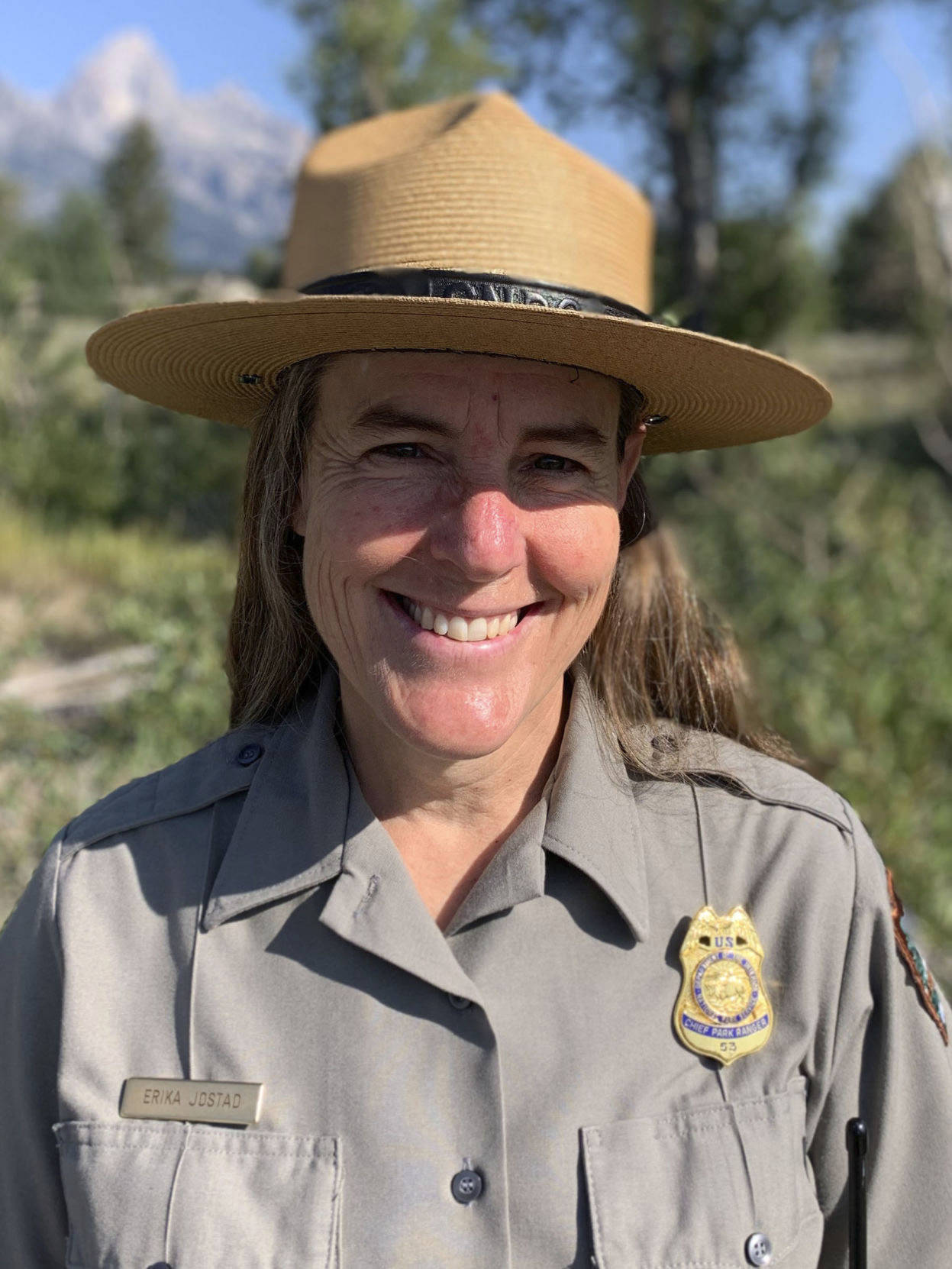 This Aug. 9, 2021 photo shows Chief Ranger Erika Jostad in Grand Teton National Park in Moose, Wyo. Erika Jostad’s baseline for what Grand Teton National Park is like in the summer, is skewed by 2021, easily the busiest year in the park’s 92-year-and-running history. Teton Park’s incoming permanent chief ranger has been in the job for months on an interim basis, during which time she’s overseen some 60 “incident responses” to fire — and that’s with a couple months of wildfire season remaining. The more general emergency call caseload has ballooned, too, outpacing gains in visitation and increasing nearly 70% over the average from the past five years.(Mike Koshmrl / Jackson Hole News & Guide)