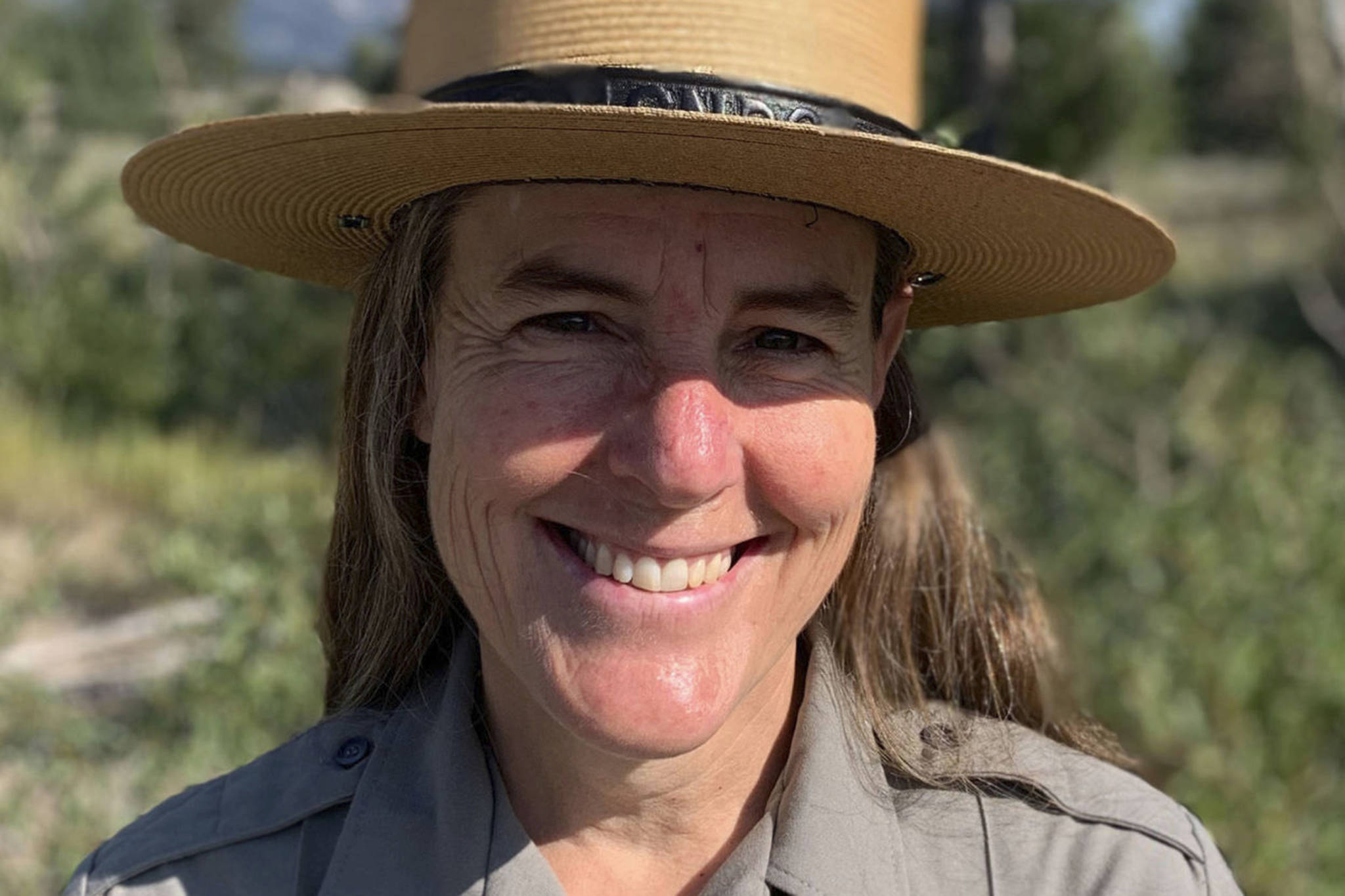 This Aug. 9, 2021 photo shows Chief Ranger Erika Jostad in Grand Teton National Park in Moose, Wyo. Erika Jostad’s baseline for what Grand Teton National Park is like in the summer, is skewed by 2021, easily the busiest year in the park’s 92-year-and-running history. Teton Park’s incoming permanent chief ranger has been in the job for months on an interim basis, during which time she’s overseen some 60 “incident responses” to fire — and that’s with a couple months of wildfire season remaining. The more general emergency call caseload has ballooned, too, outpacing gains in visitation and increasing nearly 70% over the average from the past five years.(Mike Koshmrl/Jackson Hole News & Guide)