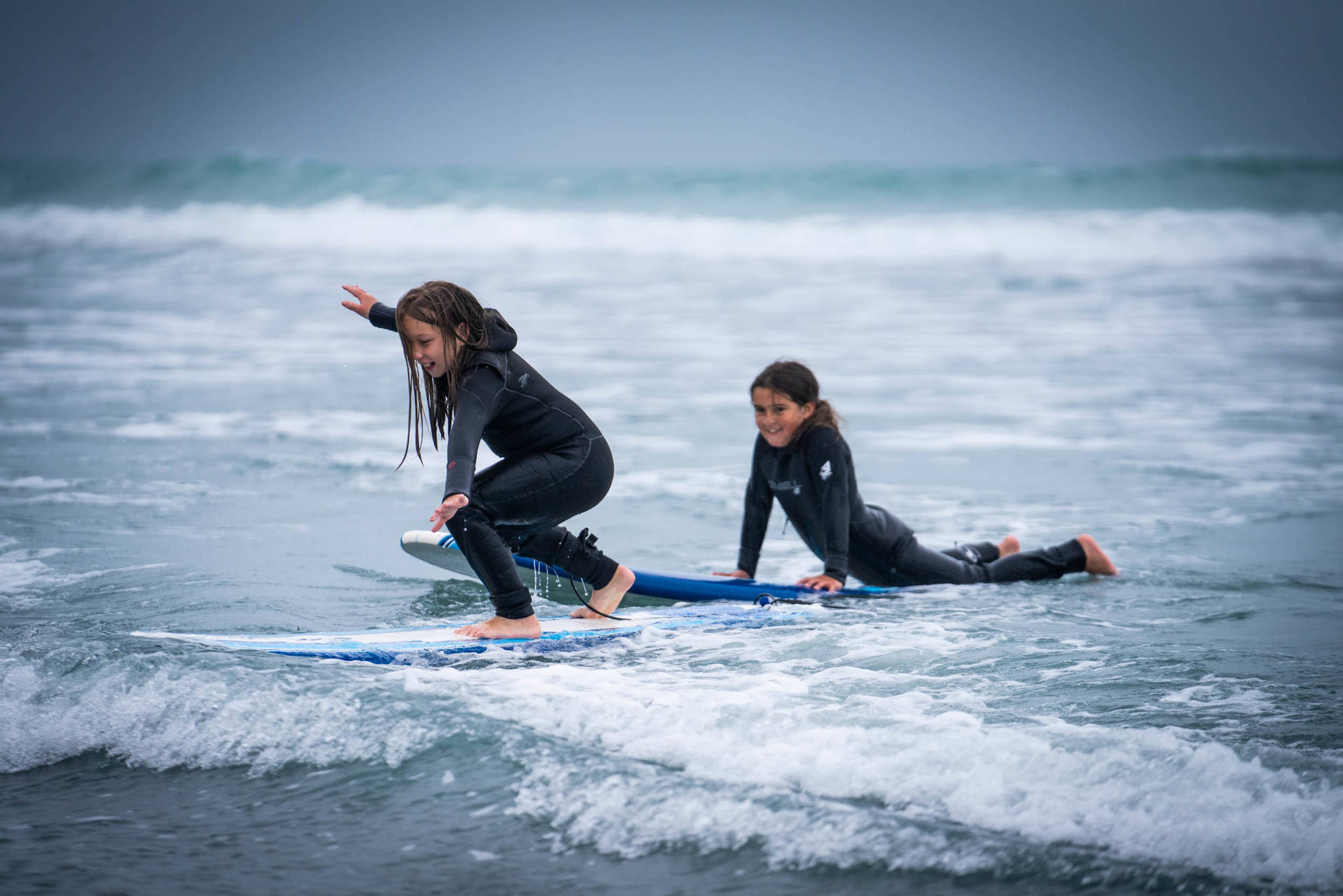 Yakutat Surf Club participants practice their form during the kickoff July camp. Standing up on a surfboard is difficult, and youth participants worked hard to challenge themselves during the week-long event. (Courtesy Photo / Bethany Sonsini Goodrich)