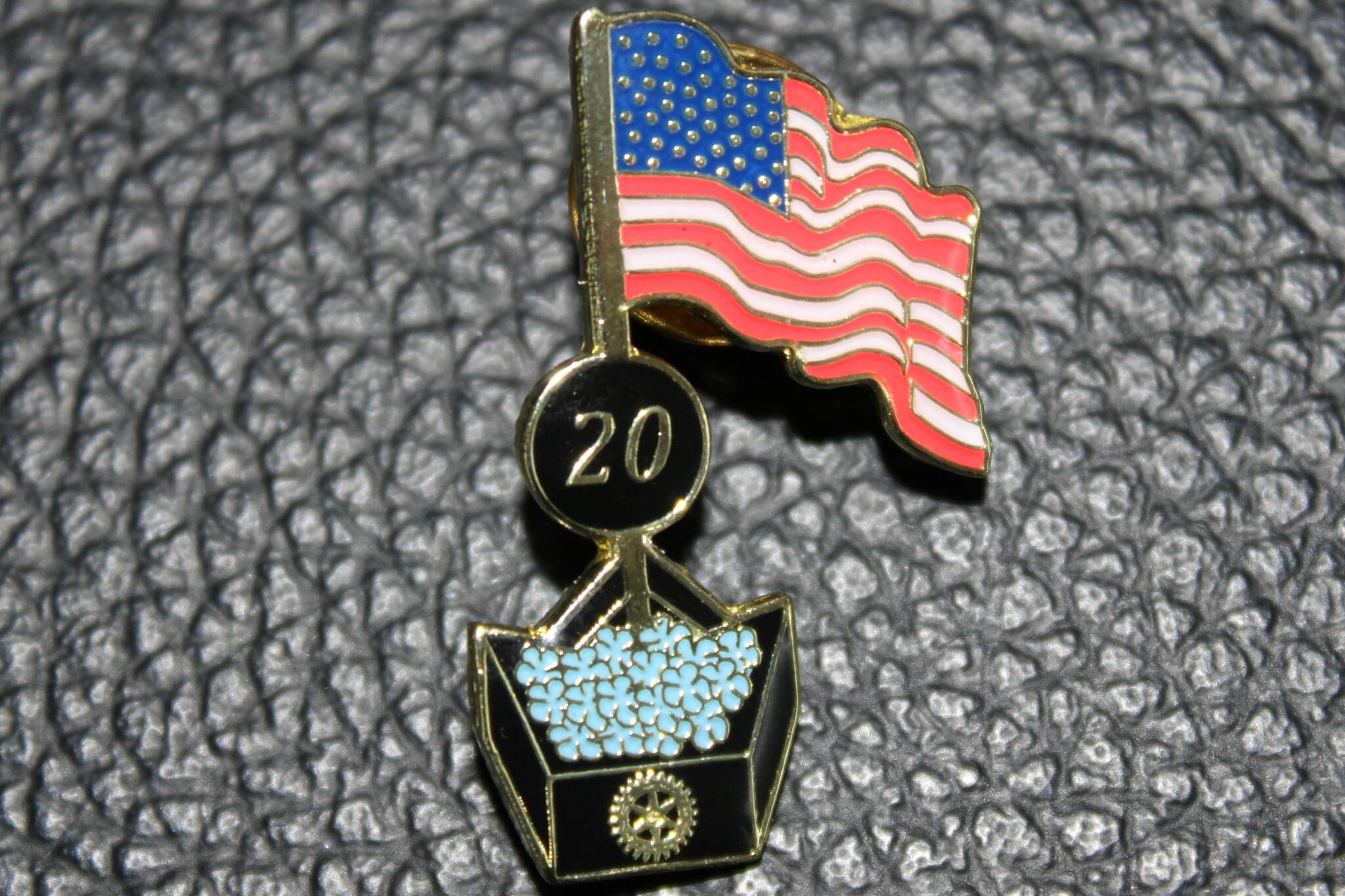 Volunteers passed out lapel pins to commemorate the occasion. (Dana Zigmund/Juneau Empire)